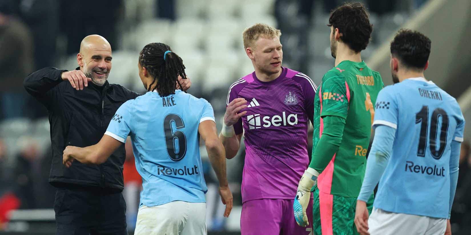 Manchester City manager Pep Guardiola and Manchester City's Nathan Ake celebrate as Newcastle United's Aaron Ramsdale shakes hands with Manchester City's James Trafford