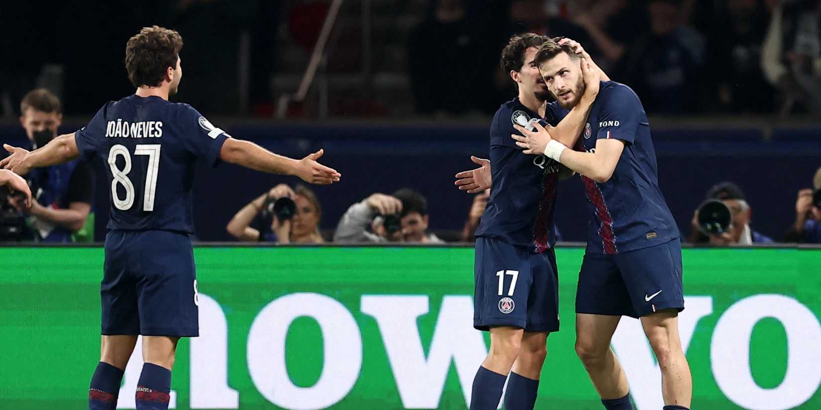 Paris St Germain's Khvicha Kvaratskhelia celebrates scoring their second goal with Vitinha and Joao Neves