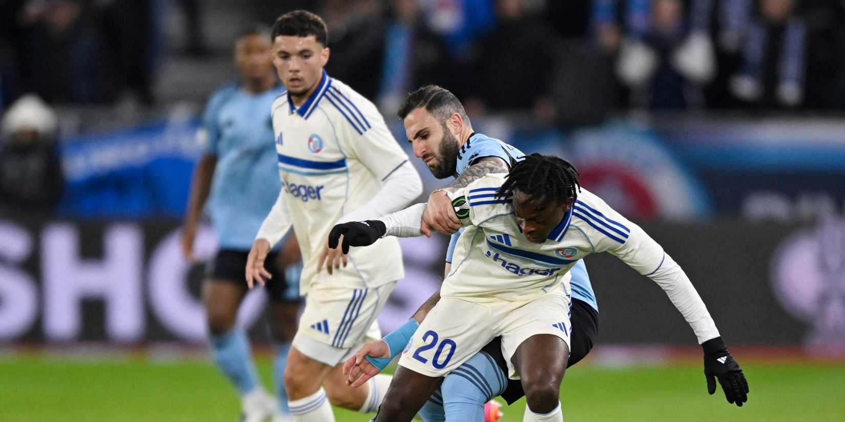 Strasbourg's Martial Godo in action with Slovan Bratislava's Tigran Barseghyan