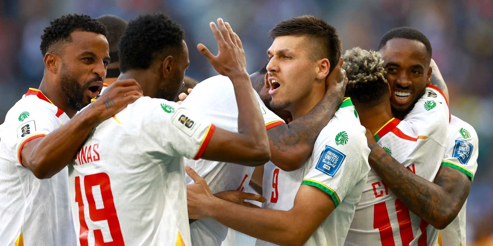Joel Piroe of Suriname and Shaquille Pinas of Suriname celebrate their first goal with their teammates scored by Liam van Gelderen of Suriname