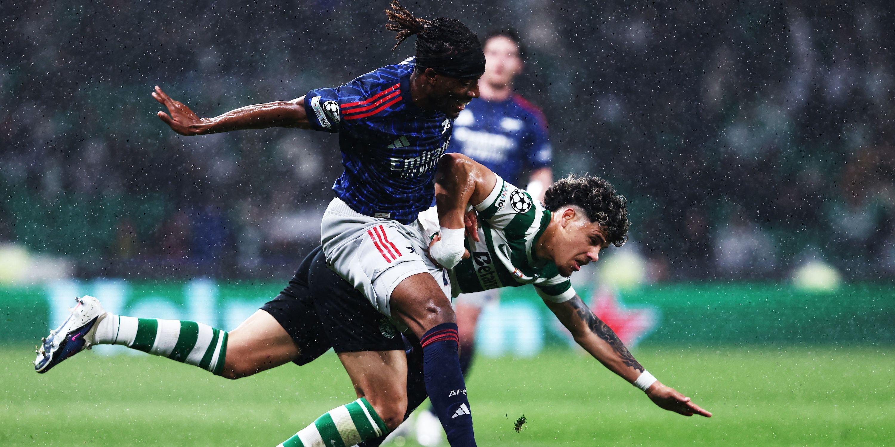 Arsenal's Noni Madueke in action with Sporting CP's Maximiliano Araujo 