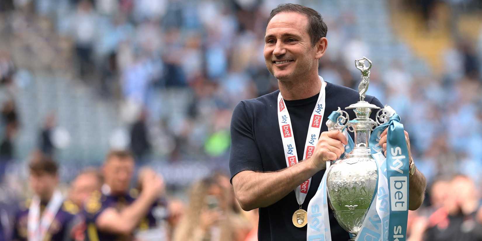 Coventry City manager Frank Lampard celebrates with the trophy after winning the Championship