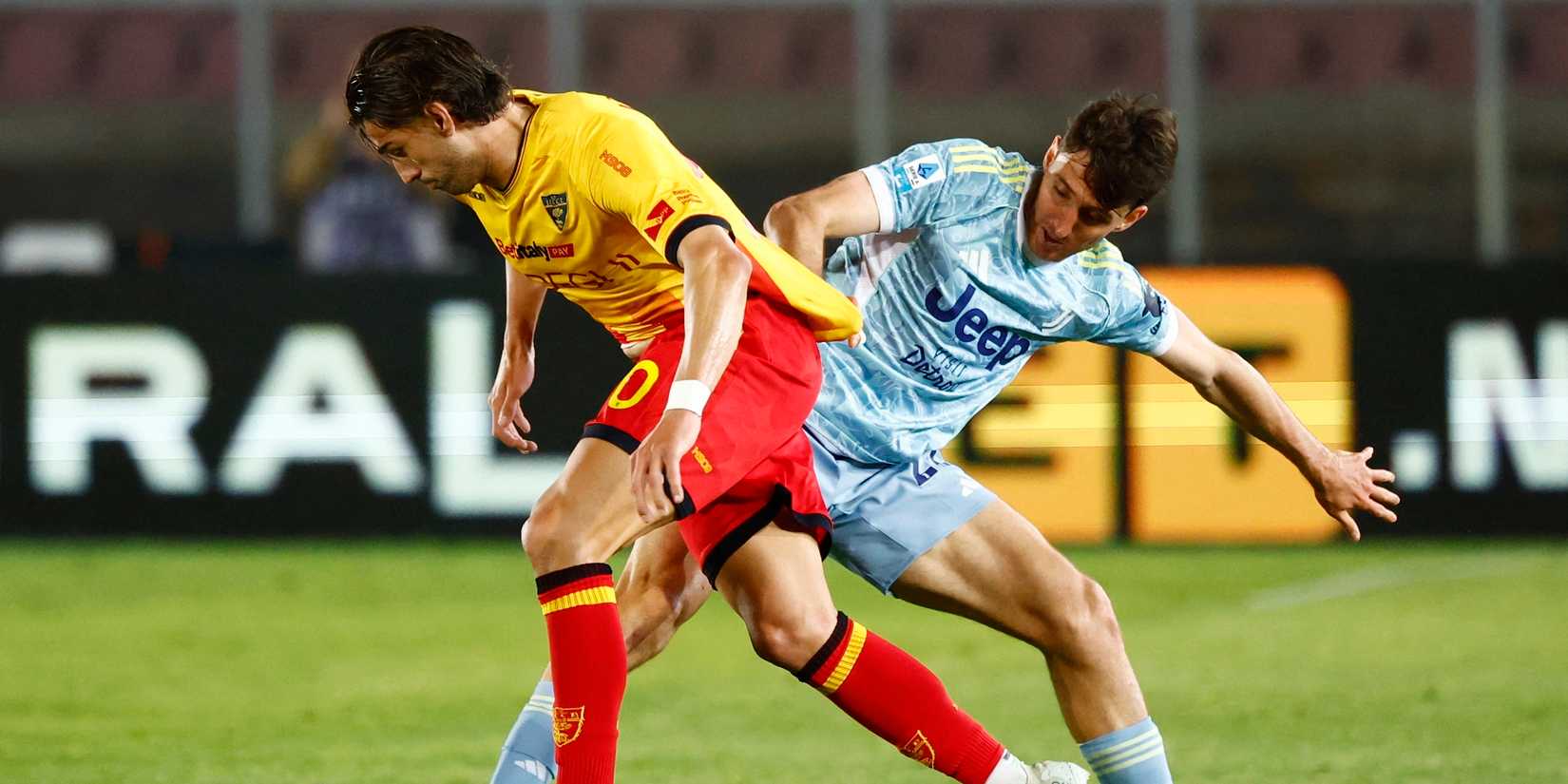 Lecce's Santiago Pierotti in action with Juventus' Andrea Cambiaso
