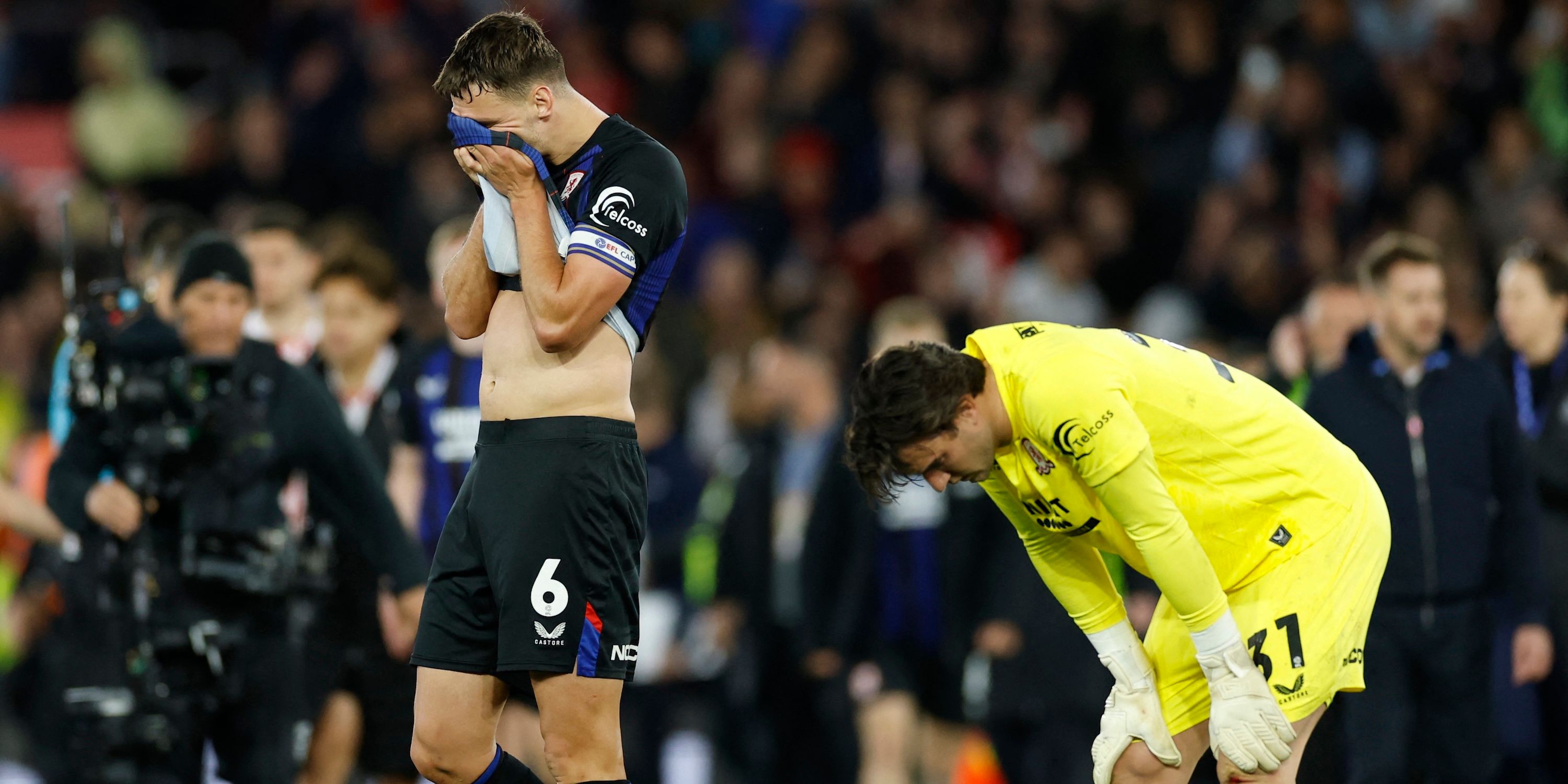   Middlesbrough's Dael Fry and Middlesbrough's Solomon Brynn look dejected