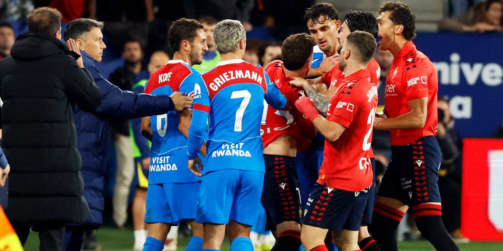 Osasuna's Kike Barja clashes with Atletico Madrid's Marc Pubill 