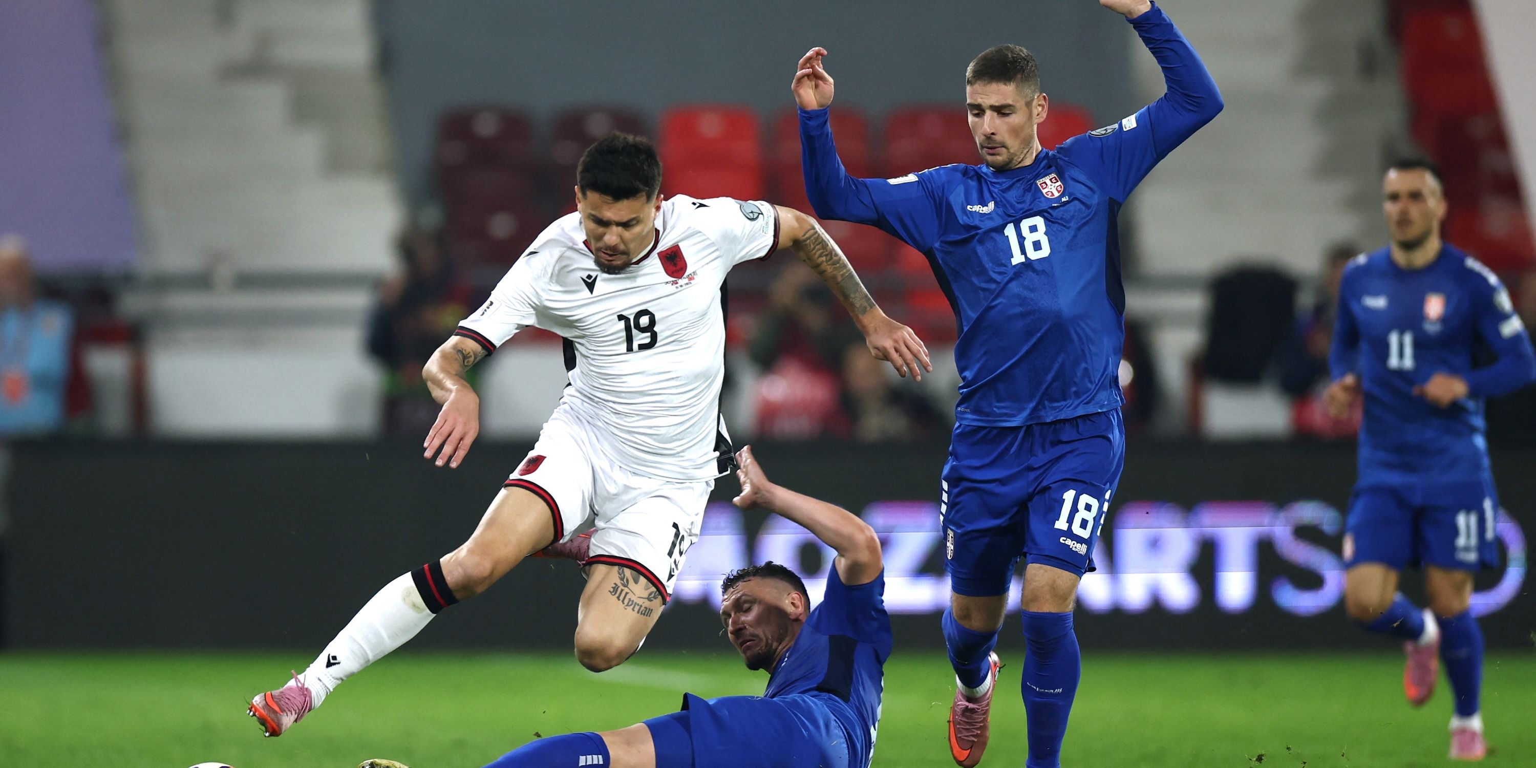Albania's Mirlind Daku in action with Serbia's Milos Veljkovic and Andrej Ilic 