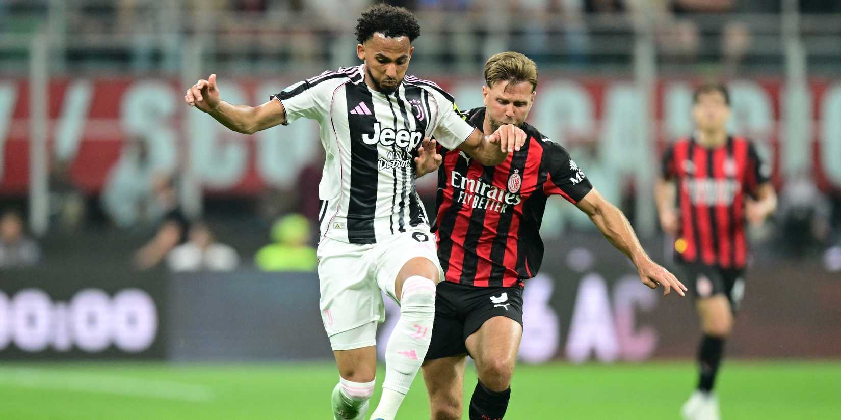 Juventus' Lloyd Kelly in action with AC Milan's Niclas Fullkrug