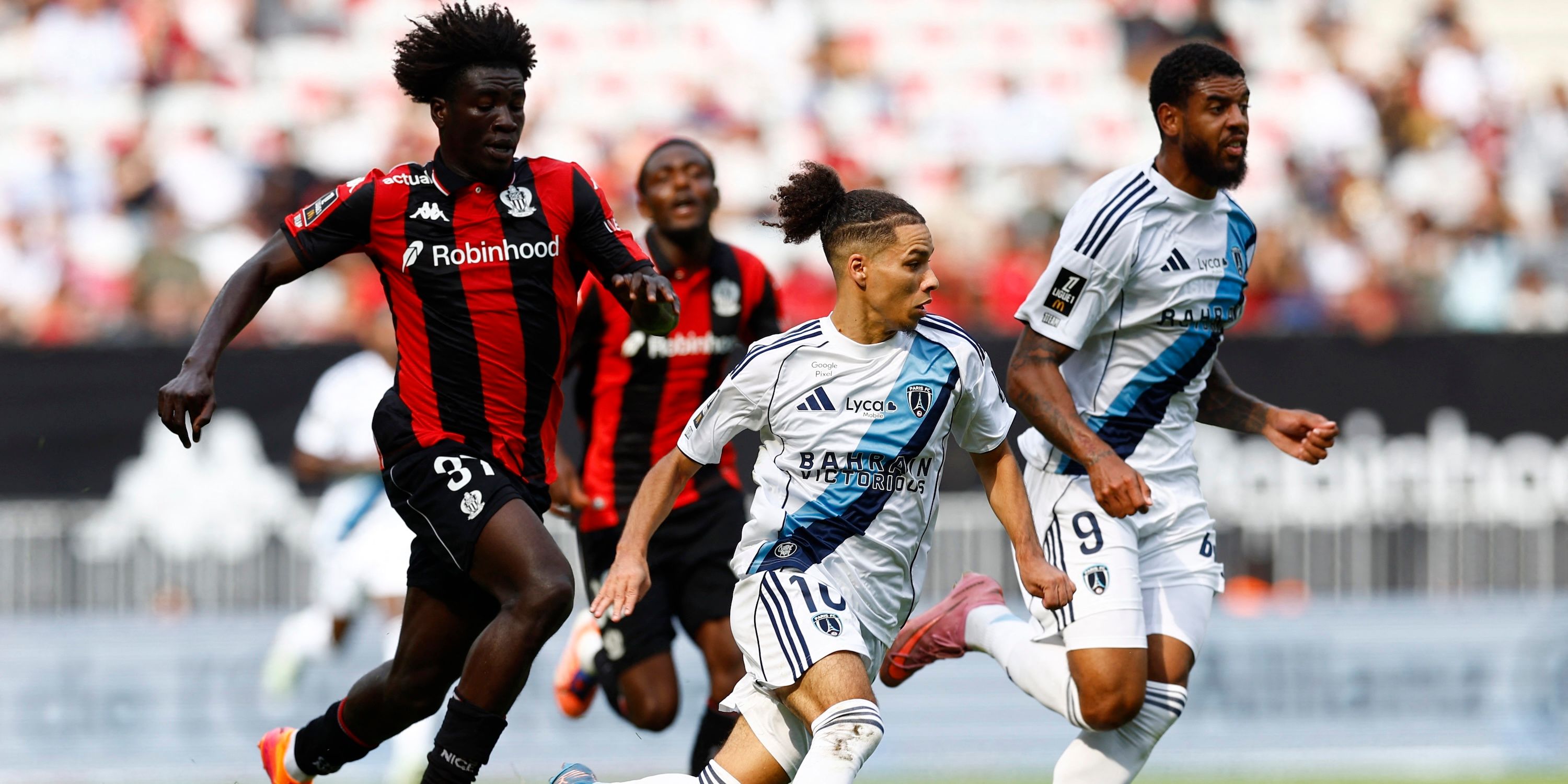 Paris FC's Ilan Kebbal and Willem Geubbels play against OGC Nice's Kojo Peprah