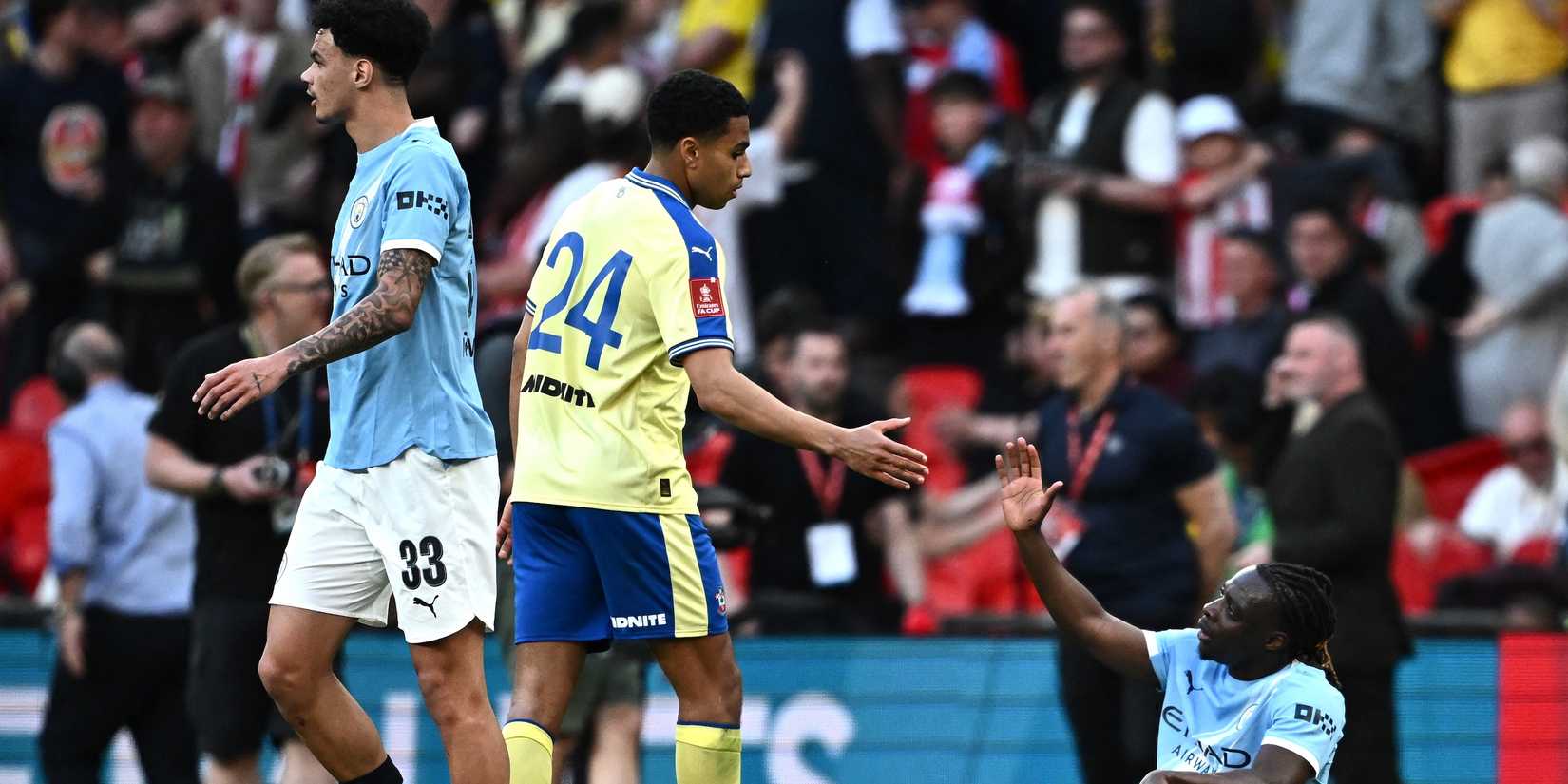 Southampton's Shea Charles with Manchester City's Jeremy Doku during the match