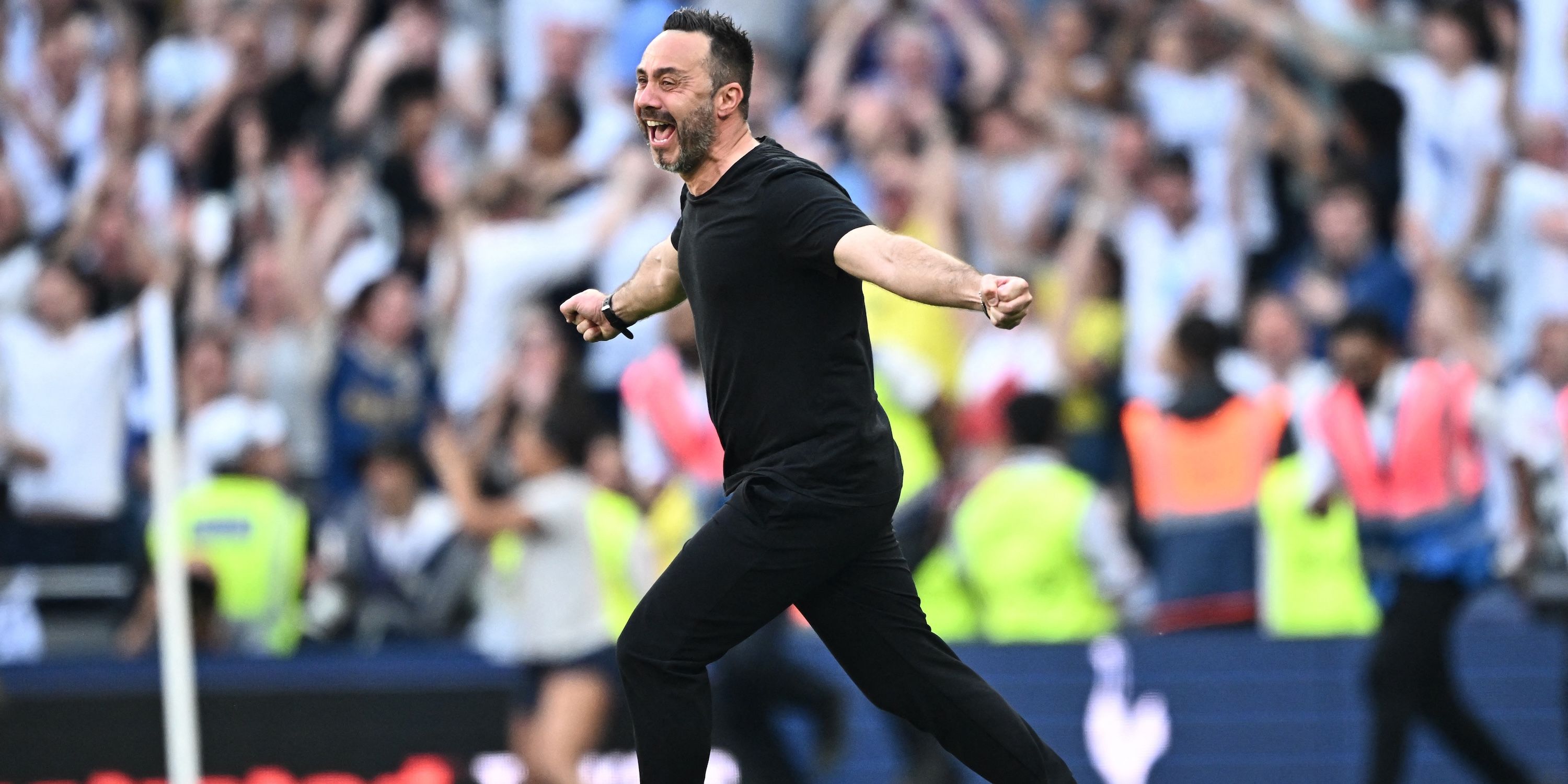 Tottenham Hotspur manager Roberto De Zerbi celebrates after the match