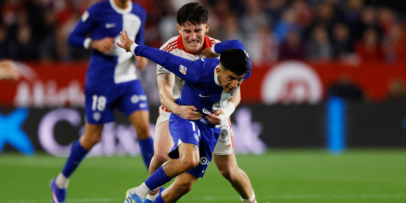 Atletico Madrid's Thiago Almada in action with Sevilla's Oso 