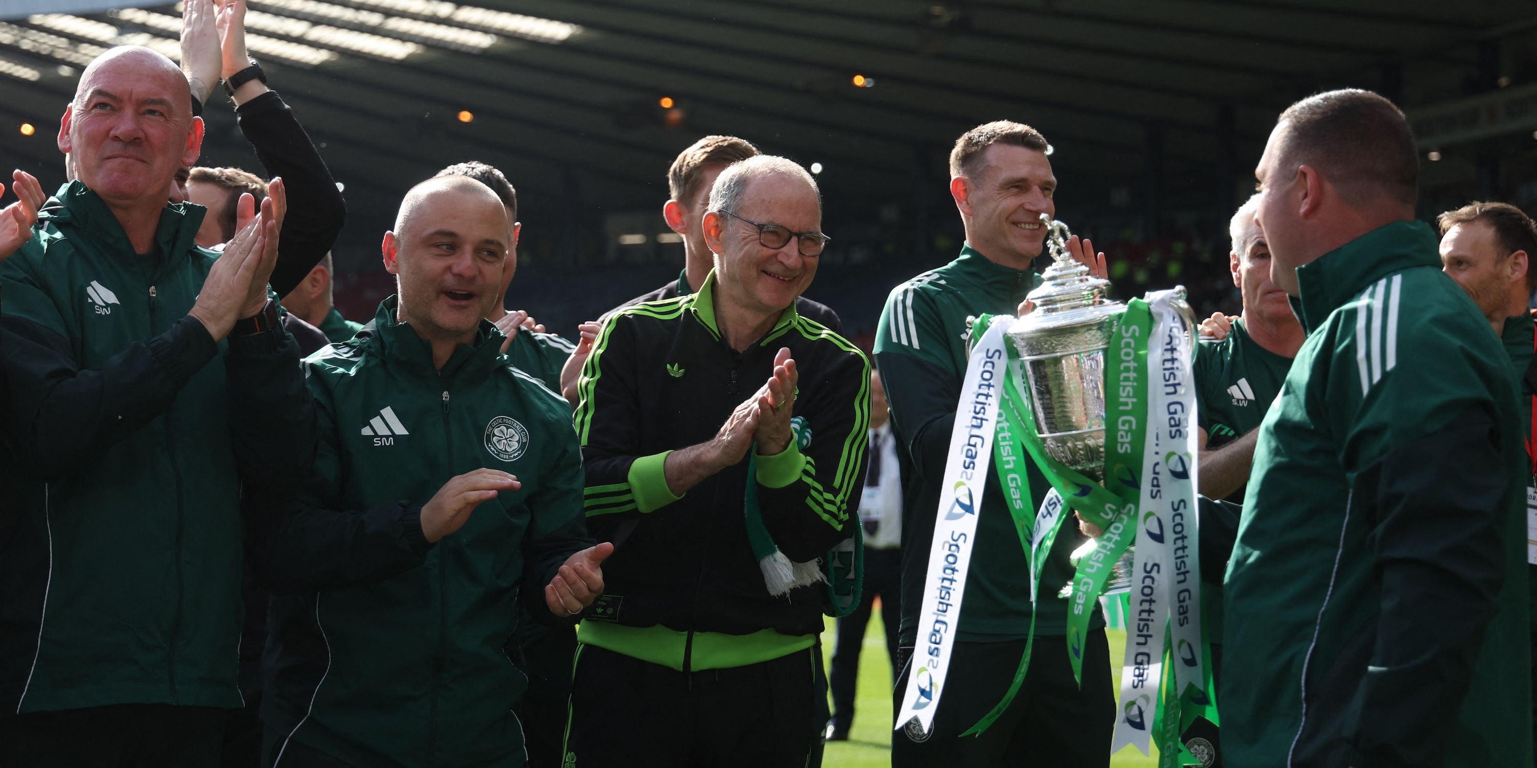 Celtic manager Martin O'Neill, assistant manager Shaun Maloney and staff celebrate with the trophy after winning the Scottish Cup