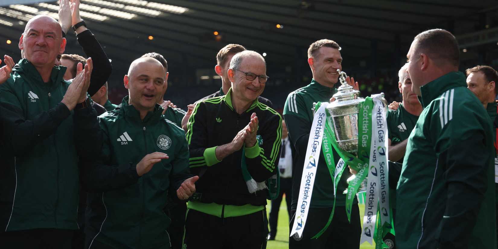 Celtic manager Martin O'Neill, assistant manager Shaun Maloney and staff celebrate with the trophy after winning the Scottish Cup