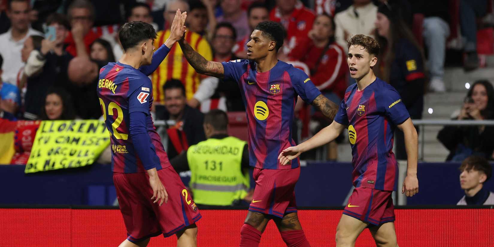 FC Barcelona's Marcus Rashford celebrates scoring their first goal with Marc Bernal and Fermin Lopez