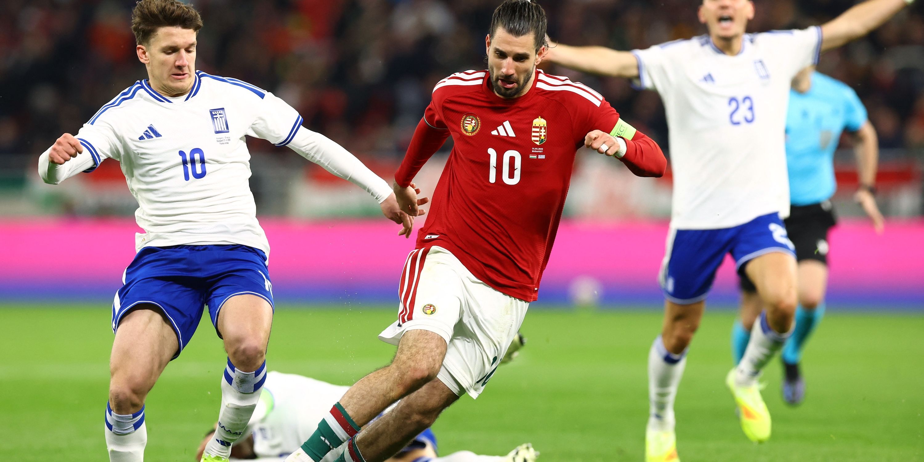 Hungary's Dominik Szoboszlai in action with Greece's Christos Tzolis