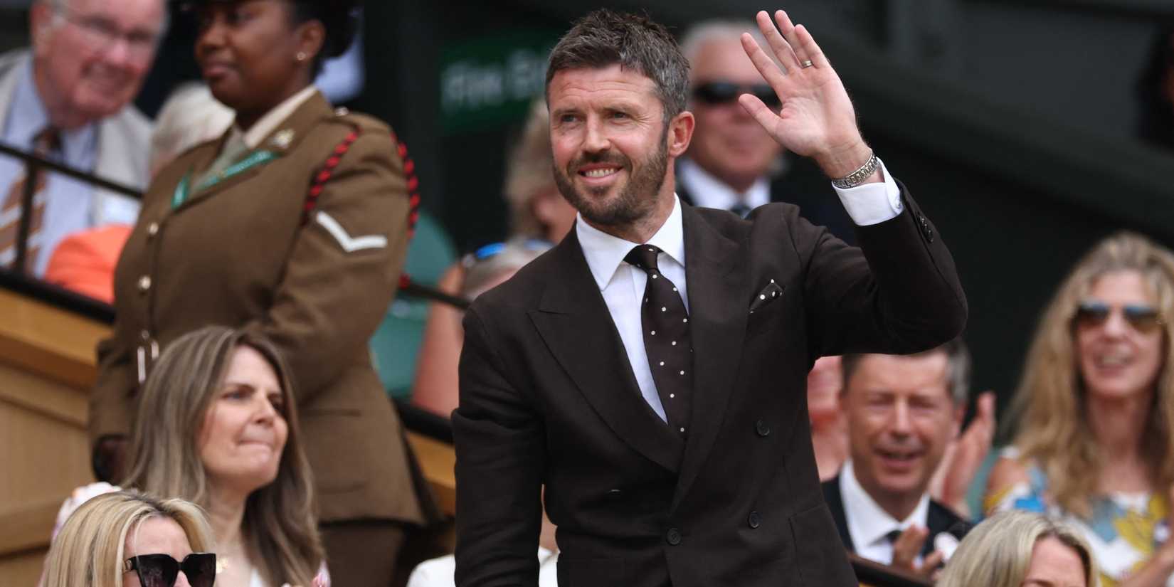 Manchester United manager Michael Carrick waves to spectators from the Royal Box ahead of the fourth round match between Russia's Roman Safiullin and Serbia's Novak Djokovic