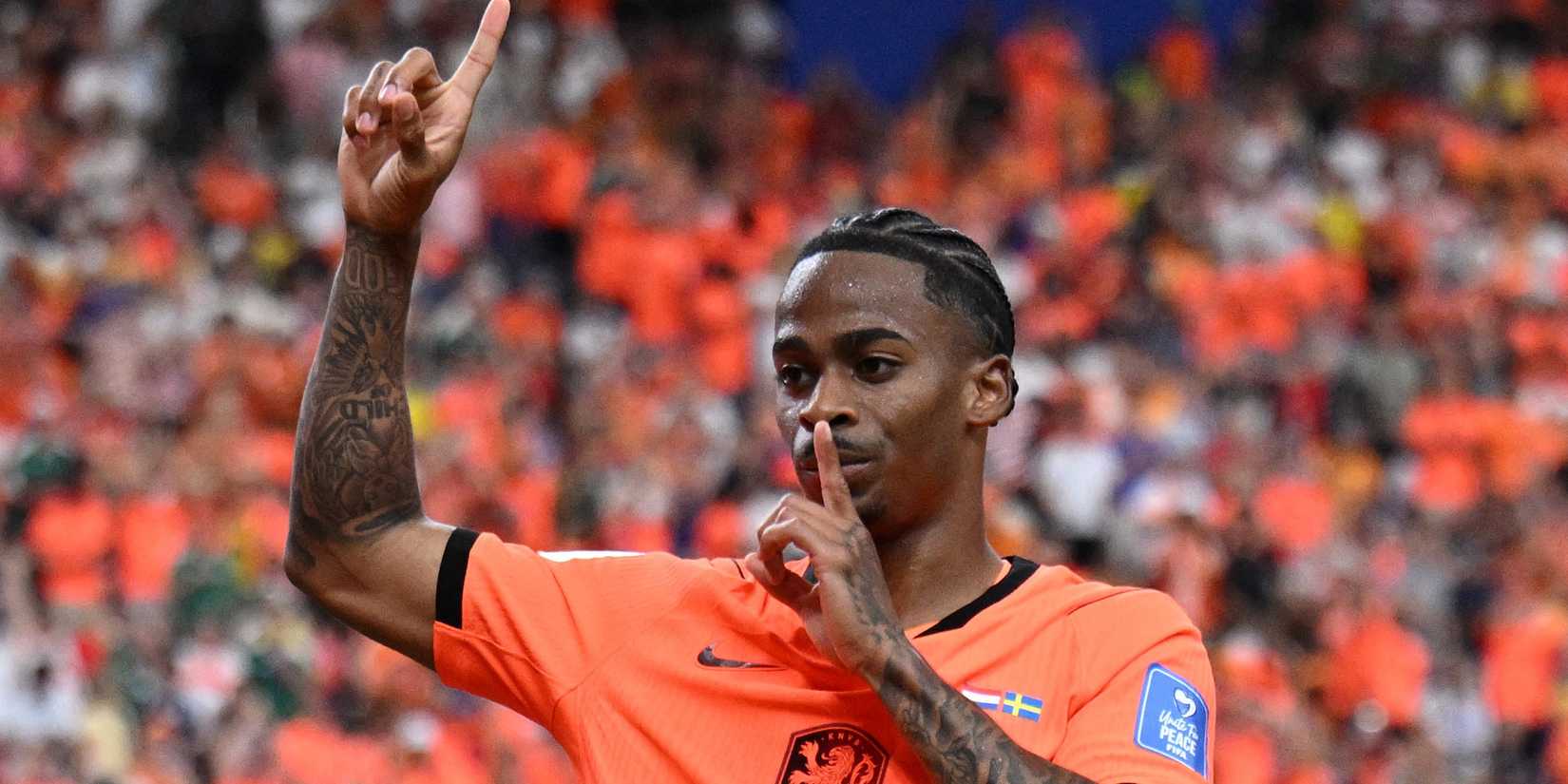 Netherlands' Crysencio Summerville celebrates scoring their fifth goal