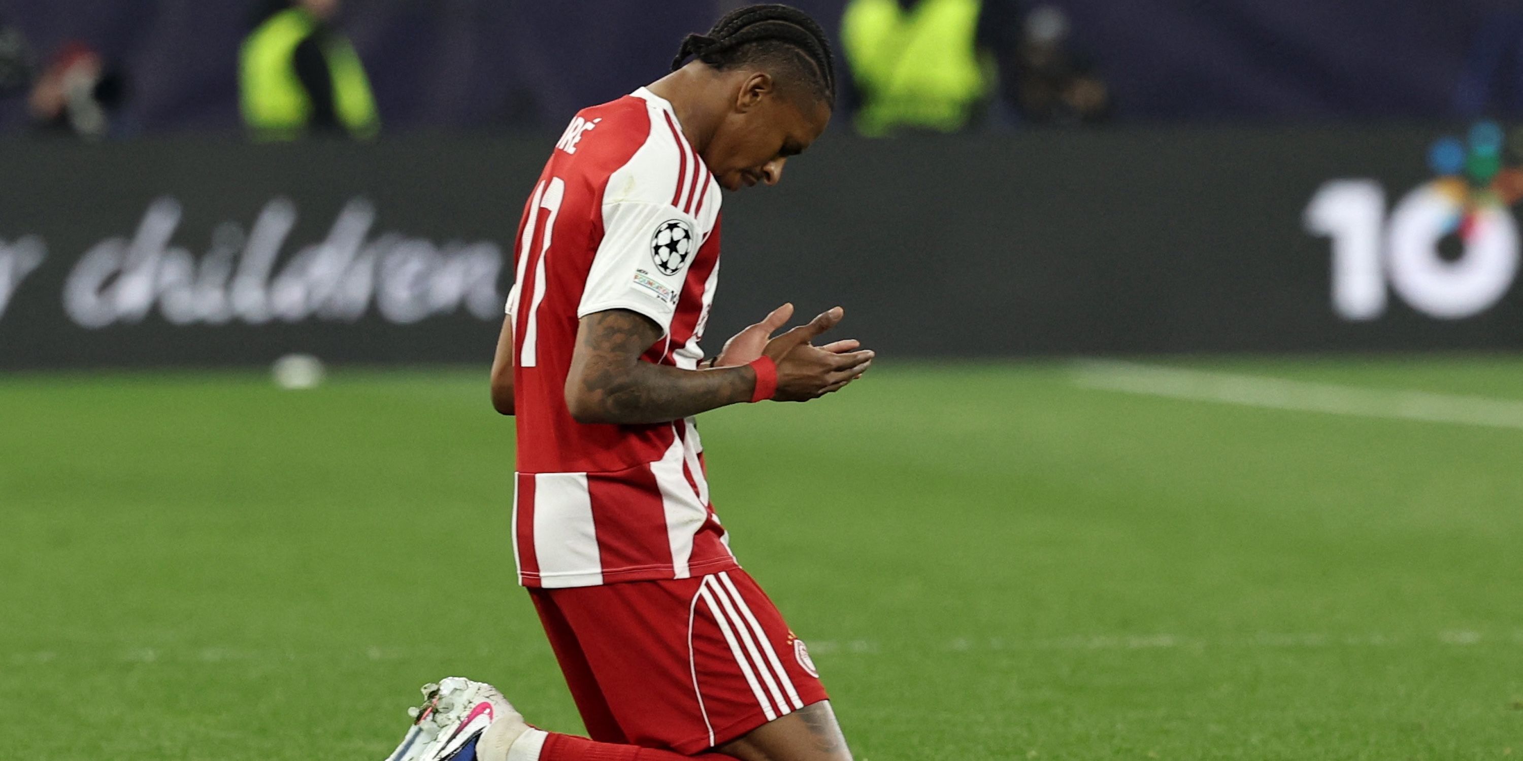 Olympiacos' Andre Luiz looks dejected after the match