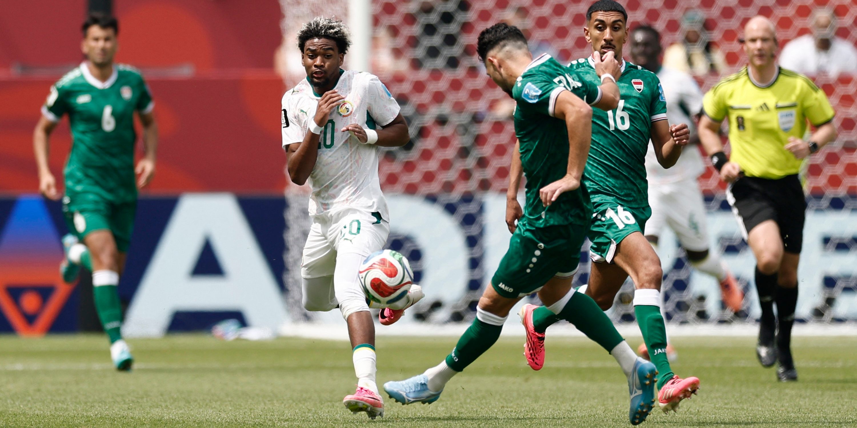 Senegal's Ibrahim Mbaye in action with Iraq's Frans Putros