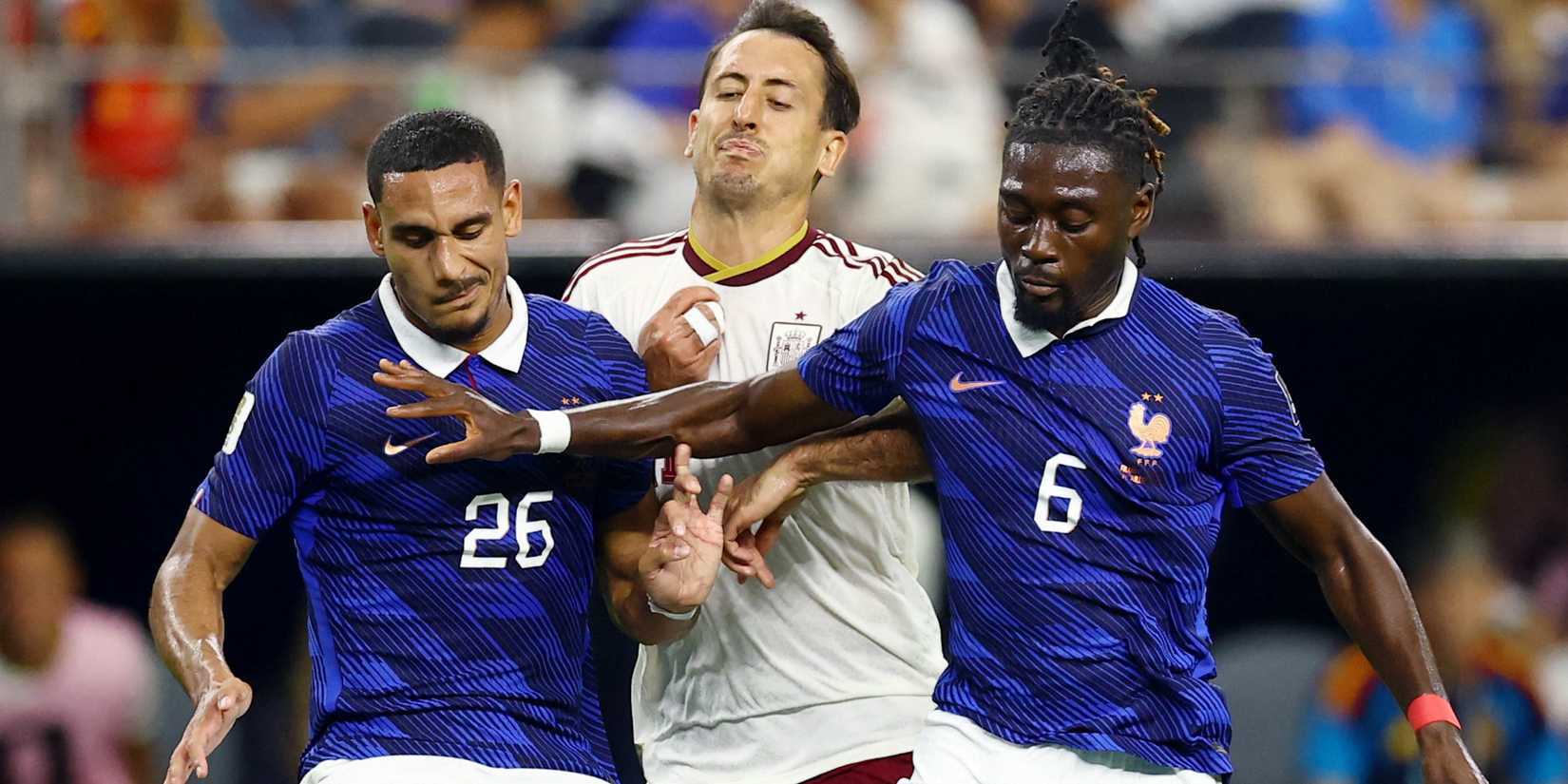 Spain's Mikel Oyarzabal in action with France's Maxence Lacroix and Manu Kone 