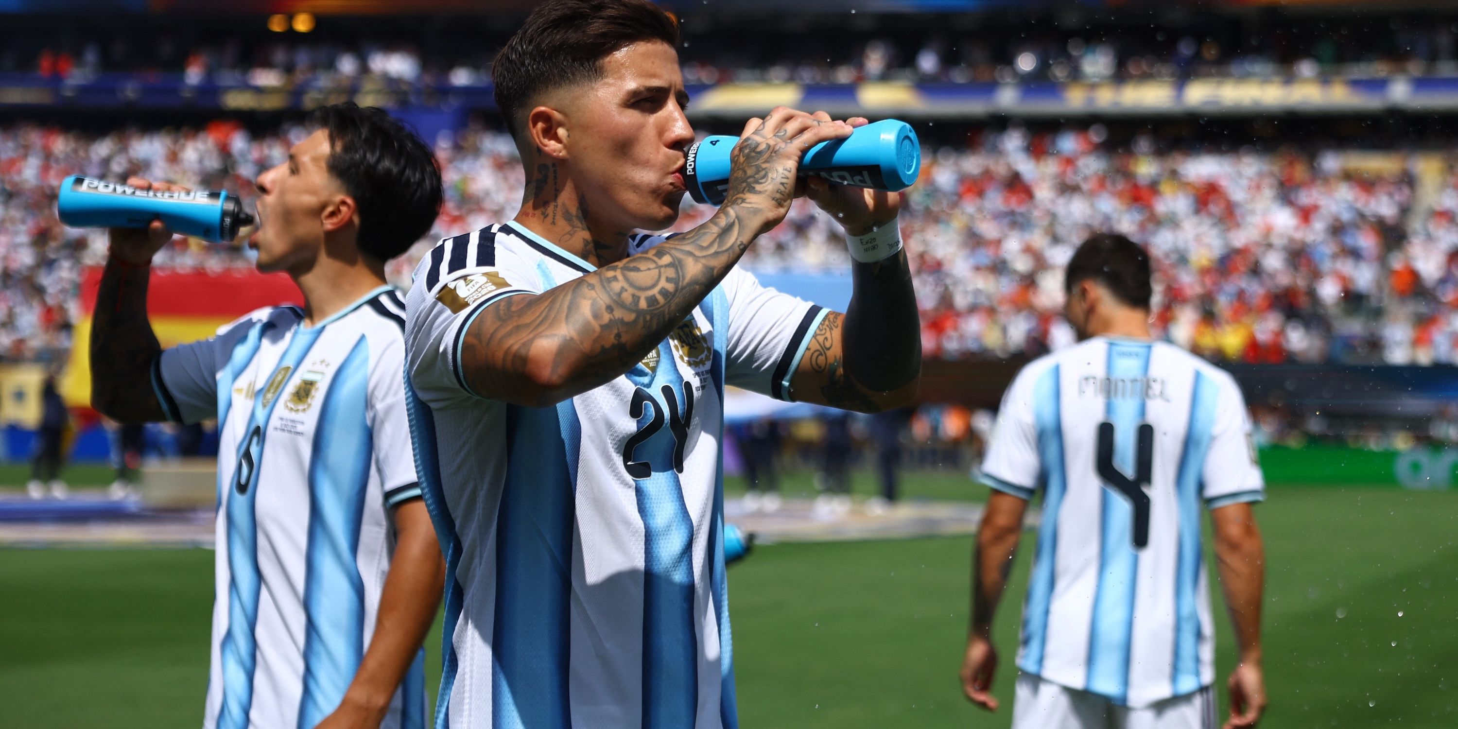 Argentina's Enzo Fernandez drinks water before the match