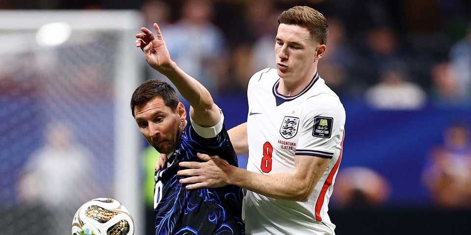 Argentina's Lionel Messi in action with England's Elliot Anderson