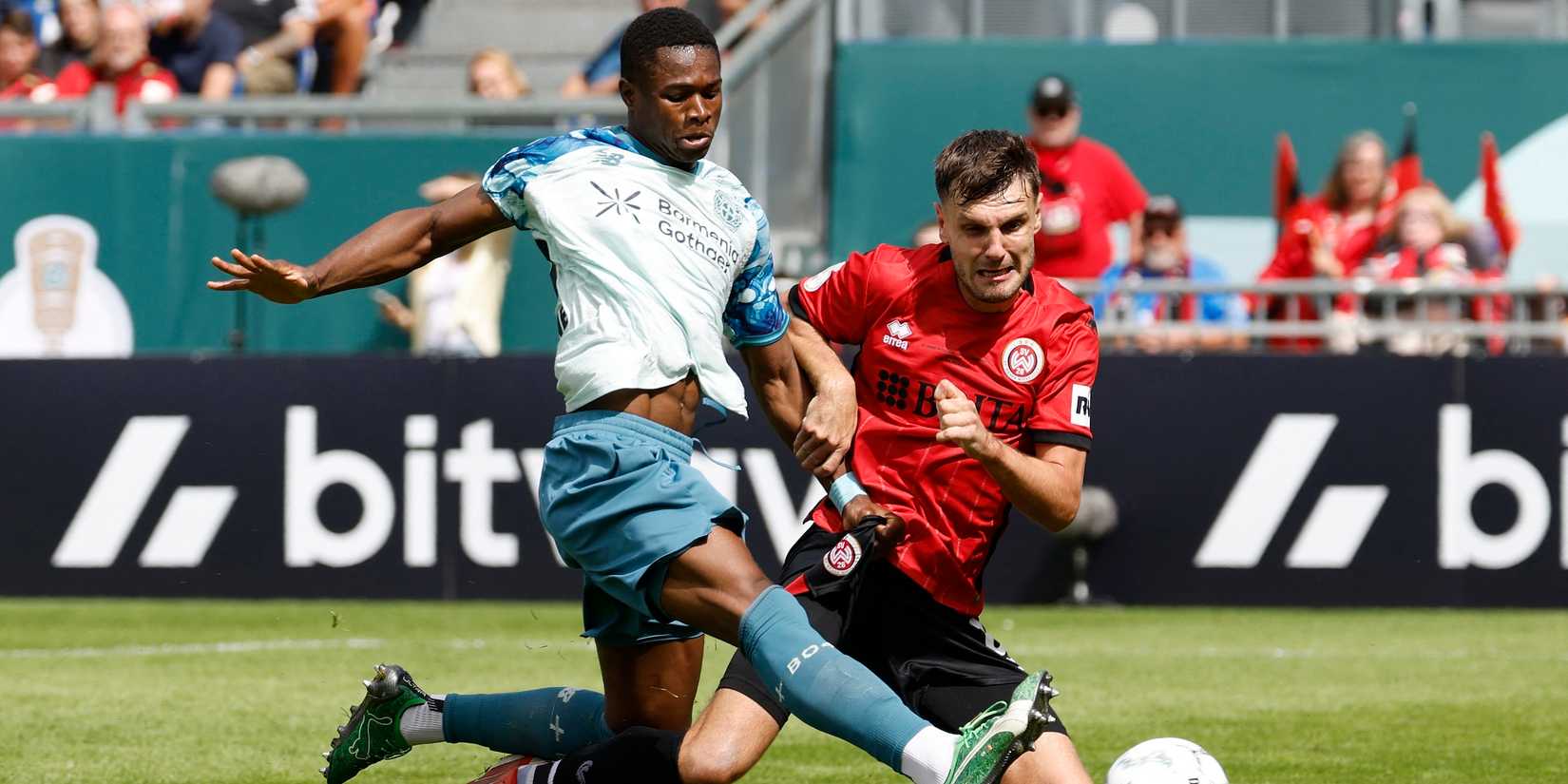 Bayer Leverkusen's Christian Kofane scores their fourth goal