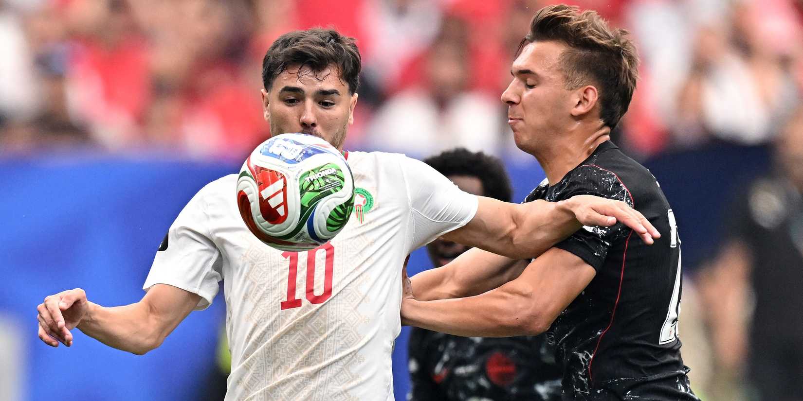 Canada's Niko Sigur in action with Morocco's Brahim Diaz