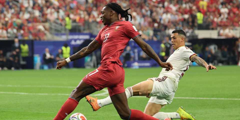 Portugal's Rafael Leao in action with Spain's Pedro Porro