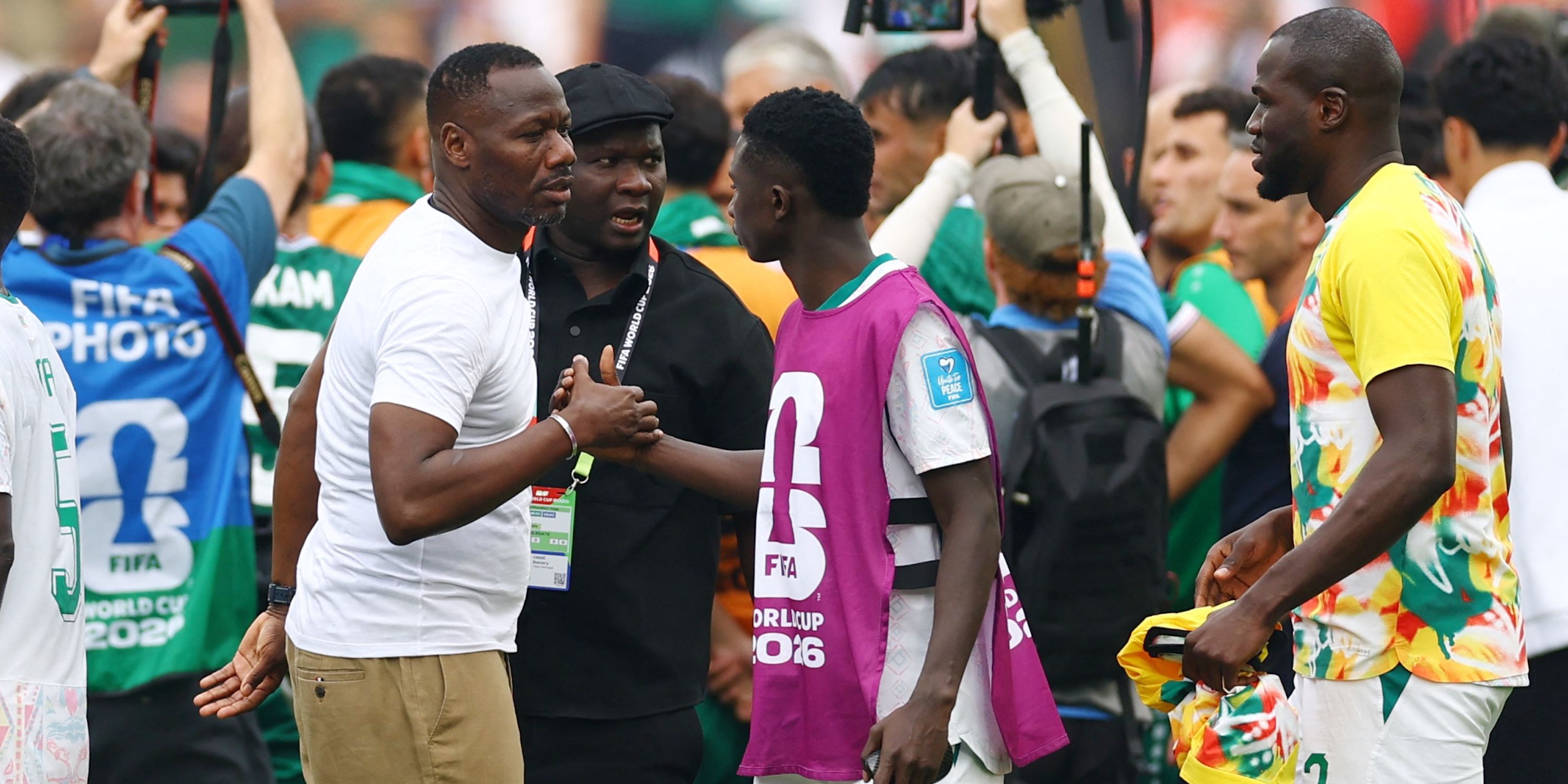 Senegal coach Pape Thiaw shakes hands with Lamine Camara after the match