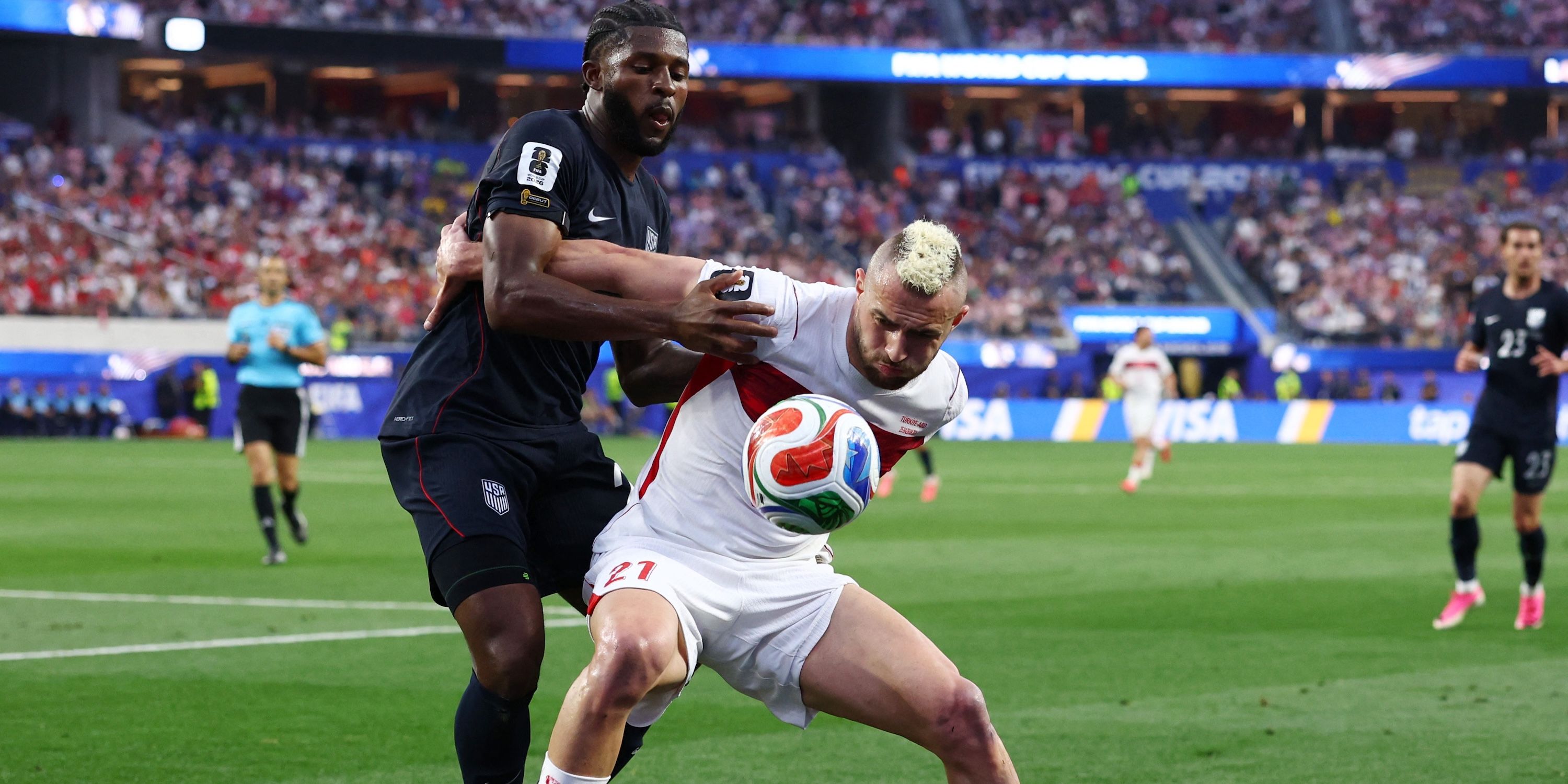 Turkey's Baris Alper Yilmaz in action with Mark McKenzie of the U.S.