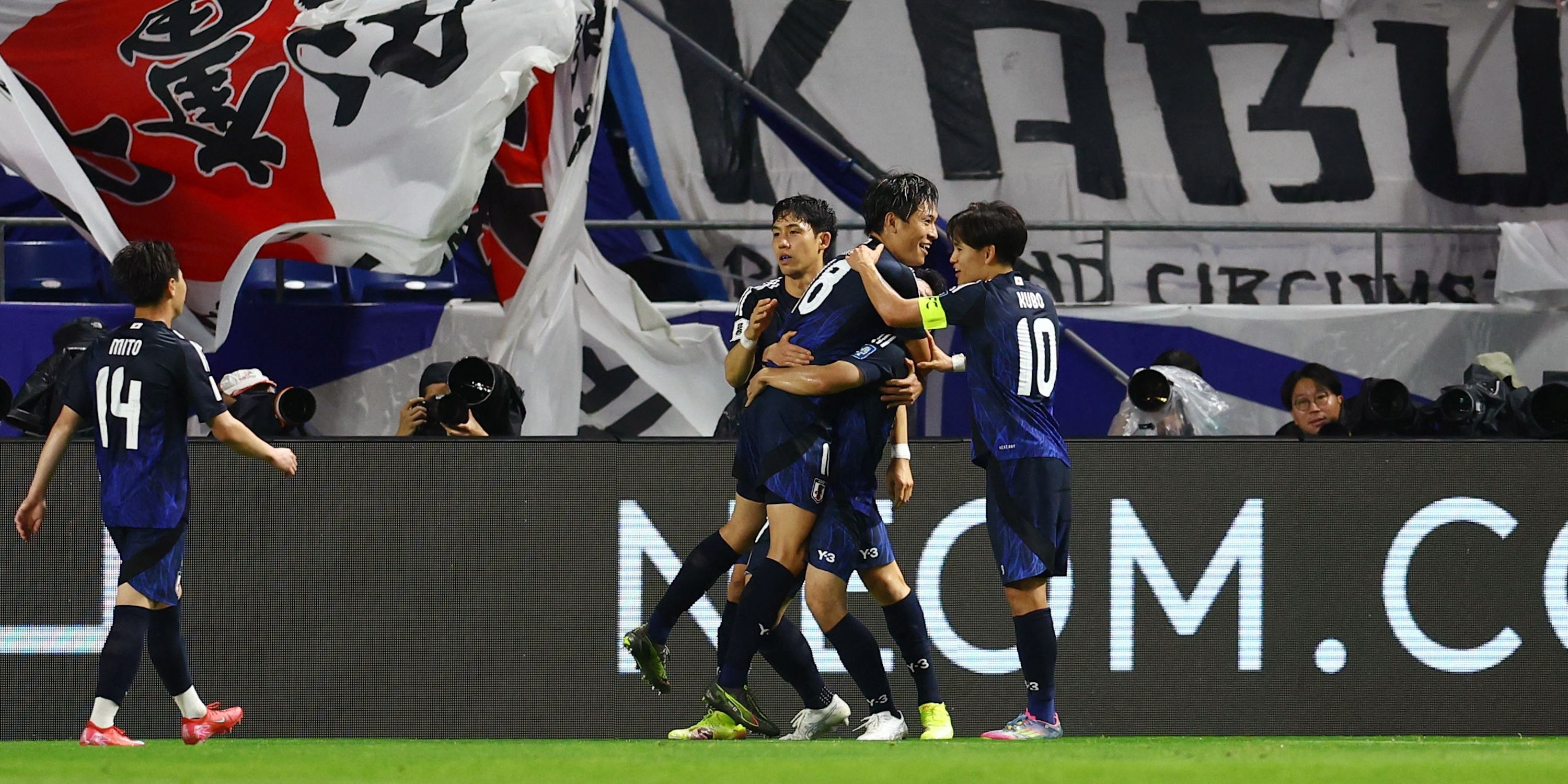 Japan's Ryoya Morishita celebrates scoring their fourth goal with teammates