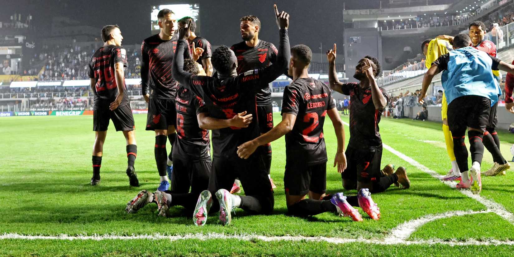 Athletico Paranaense's Kevin Viveros celebrates with teammates after scoring their first goal 