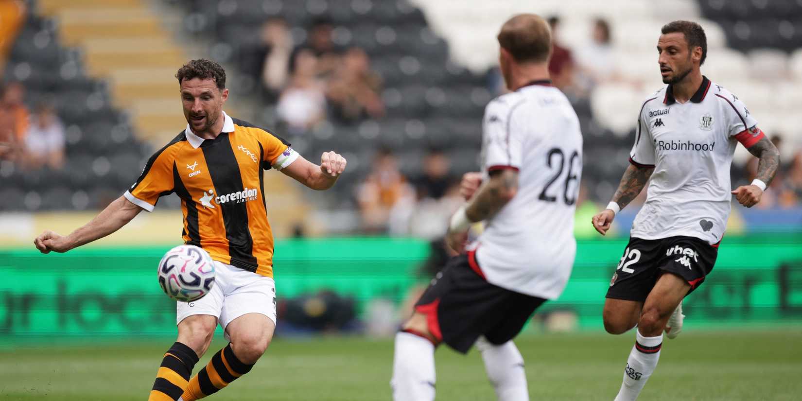 Hull City's Lewie Coyle in action with OGC Nice's Melvin Bard and Jonathan Clauss