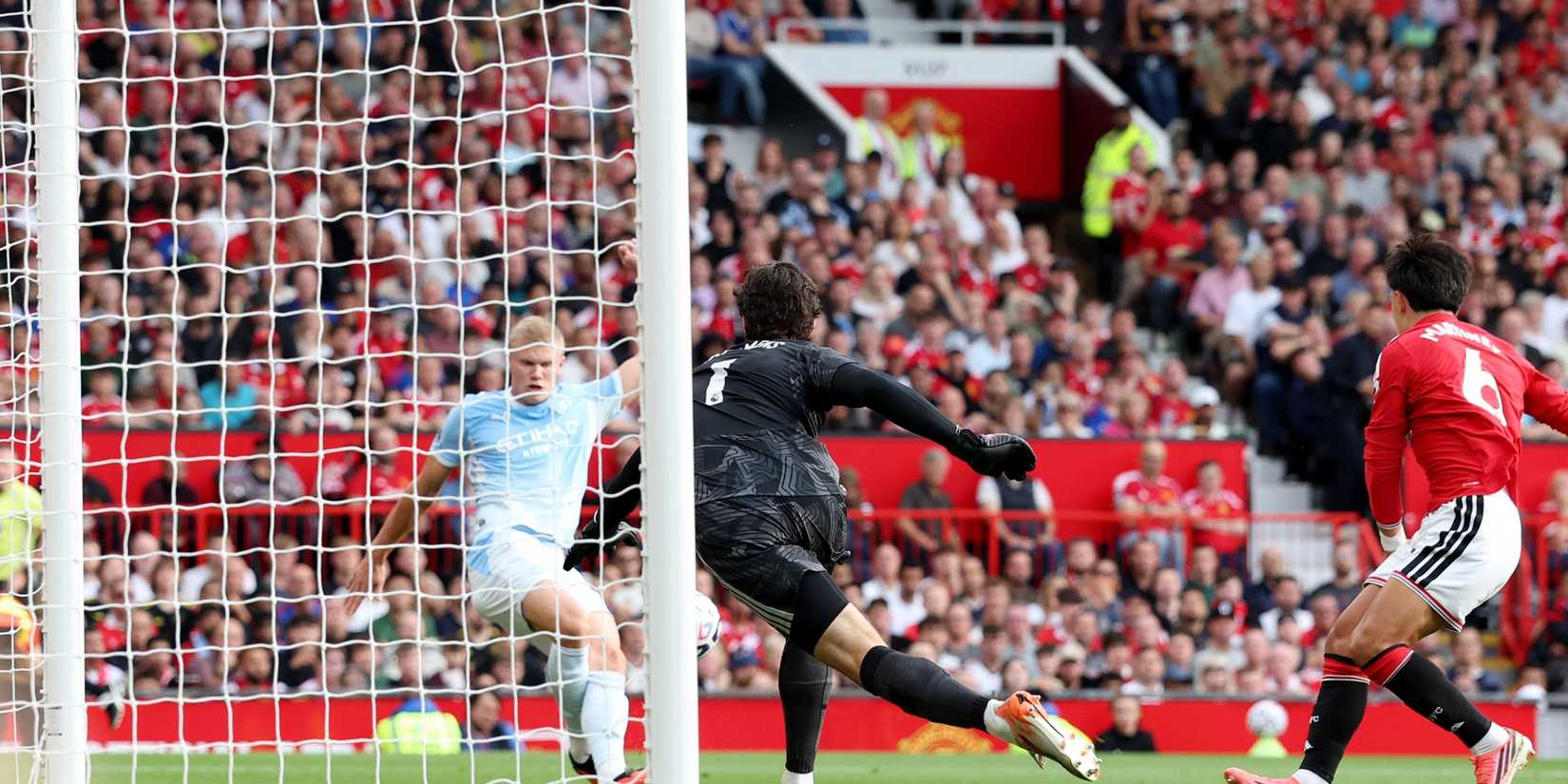 Erling Haaland scores against Manchester United