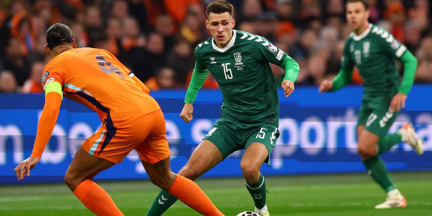 Netherlands' Virgil van Dijk in action with Lithuania's Gvidas Gineitis