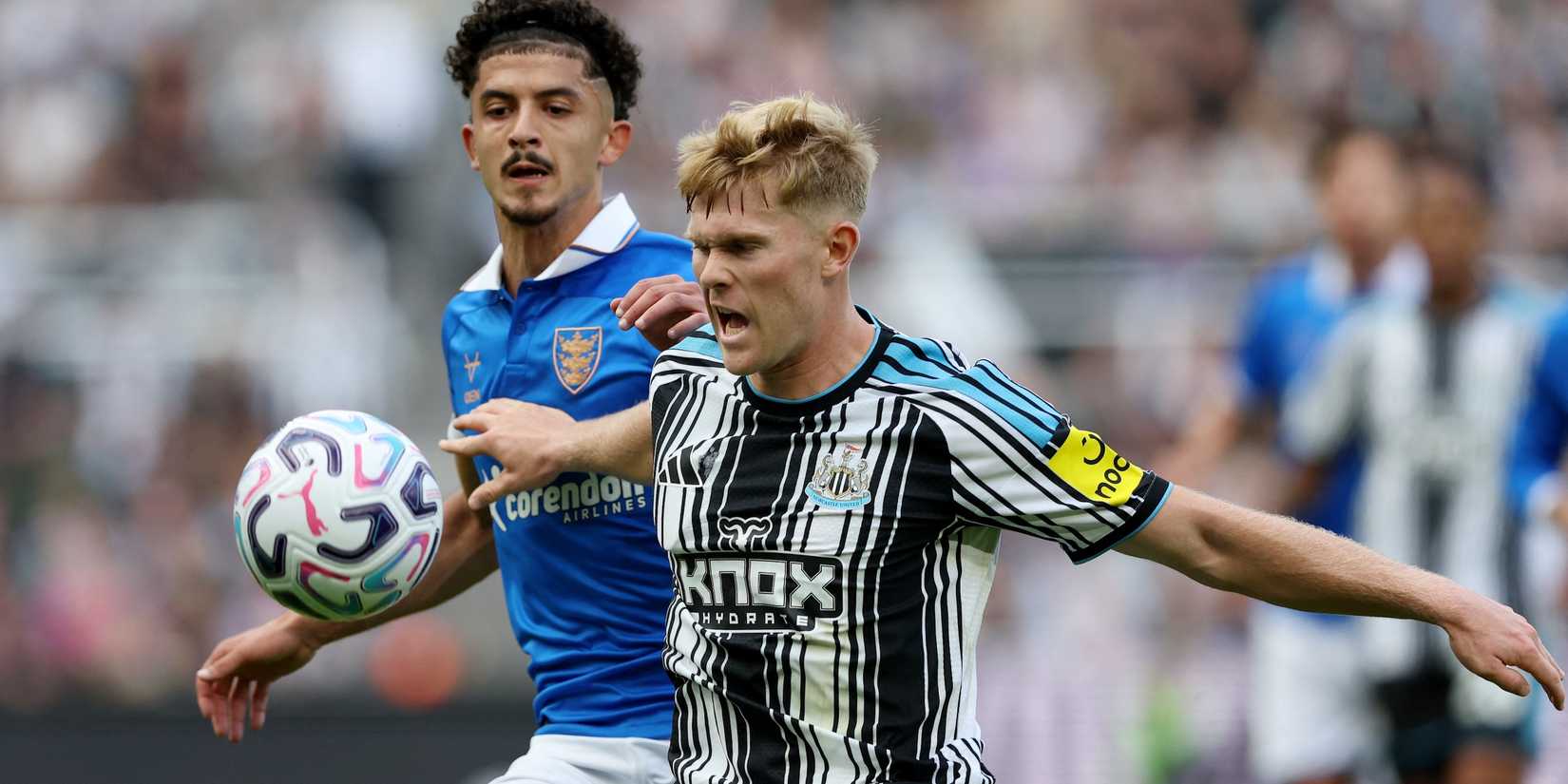 Newcastle United's Lewis Hall in action with Hull City's Mohamed Belloumi 