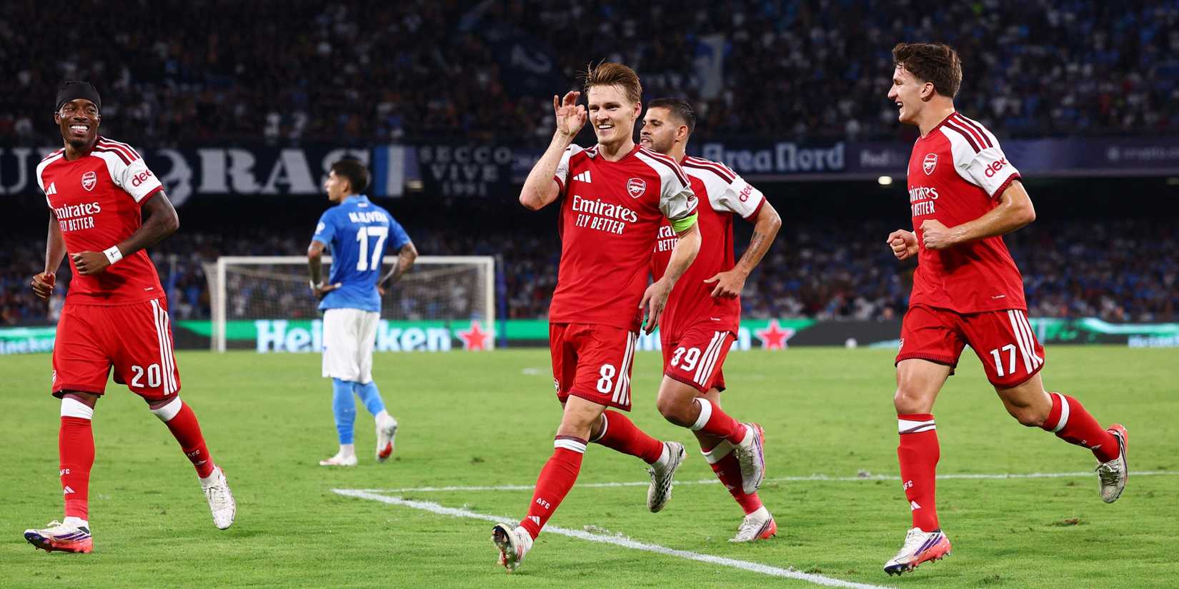 Odegaard celebrates scoring against Napoli