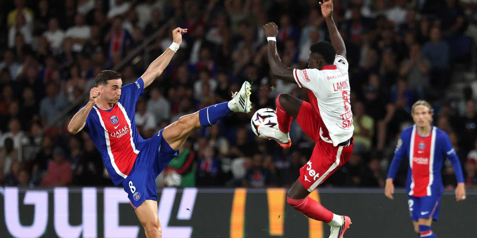 Paris St Germain's Fabian Ruiz in action with AS Monaco's Lamine Camara