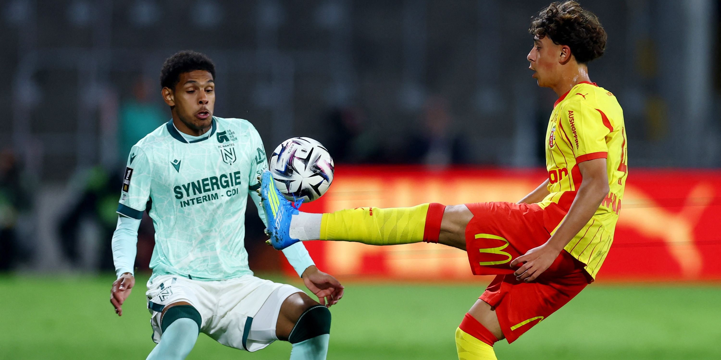 RC Lens' Mezian Soares in action with FC Nantes' Dehmaine Tabibou