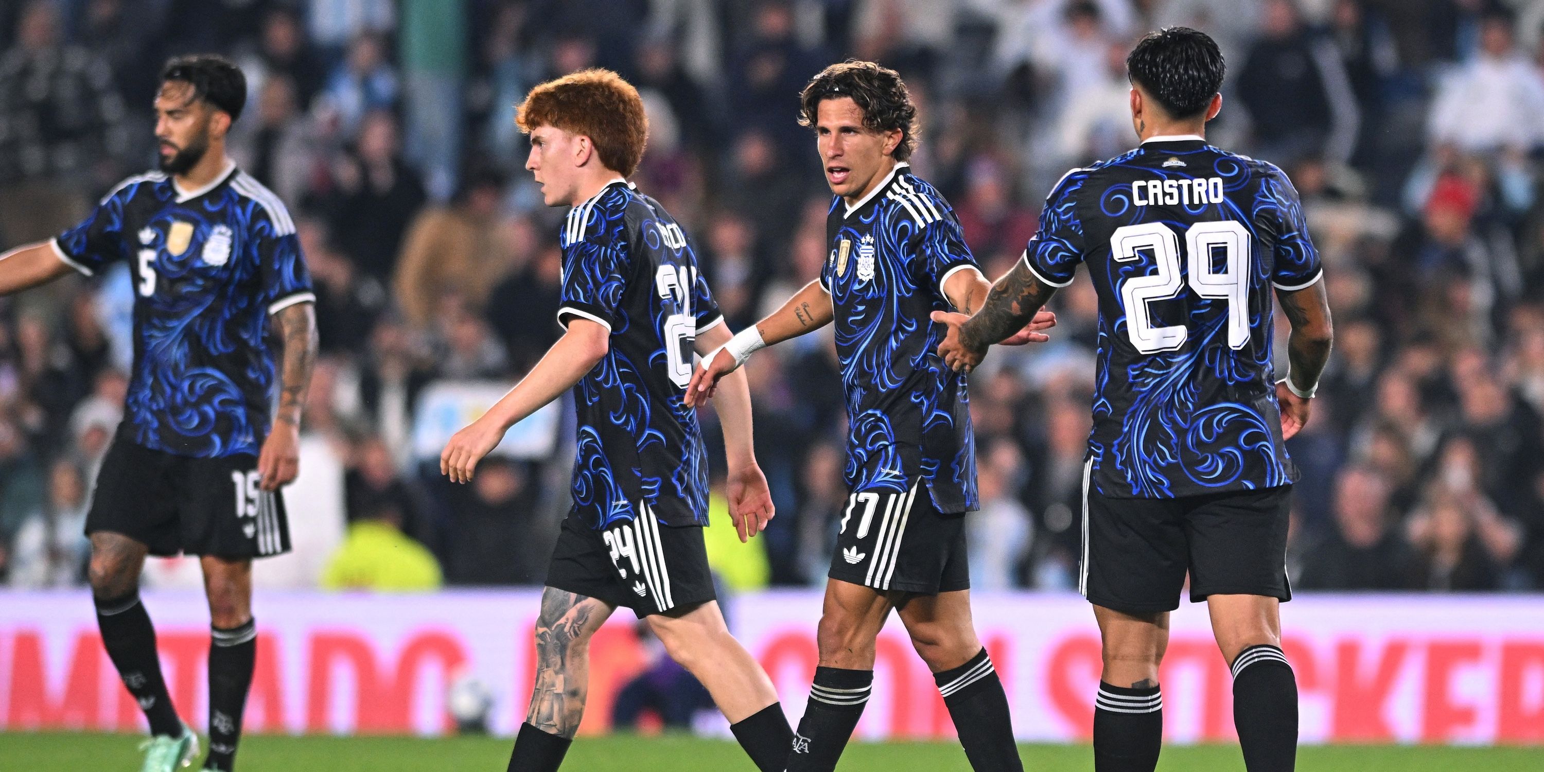 Argentina's Giuliano Simeone celebrates scoring their seventh goal with teammates