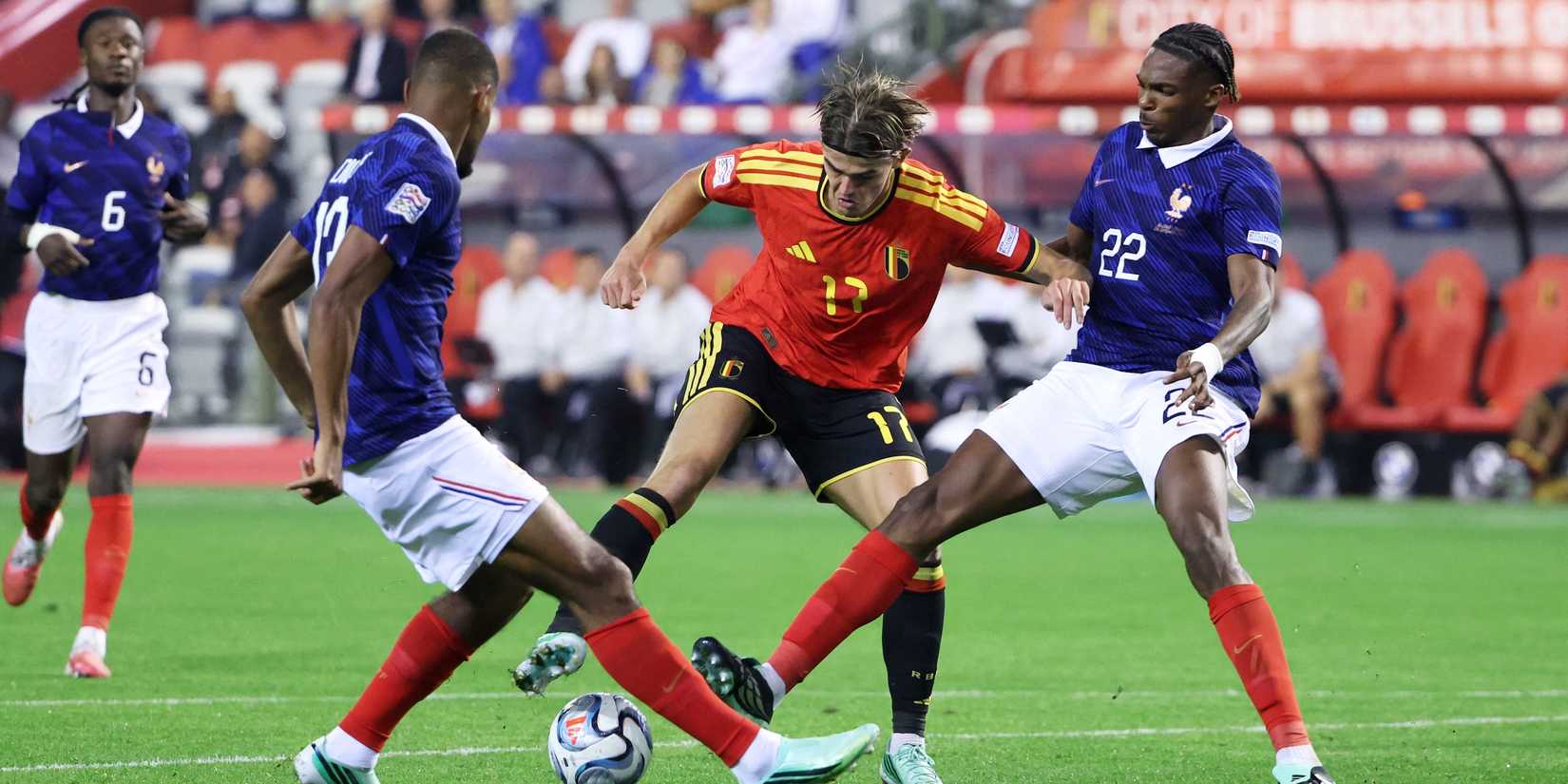 Belgium's Charles De Ketelaere in action with France's Jeremy Jacquet and Andy Diouf 