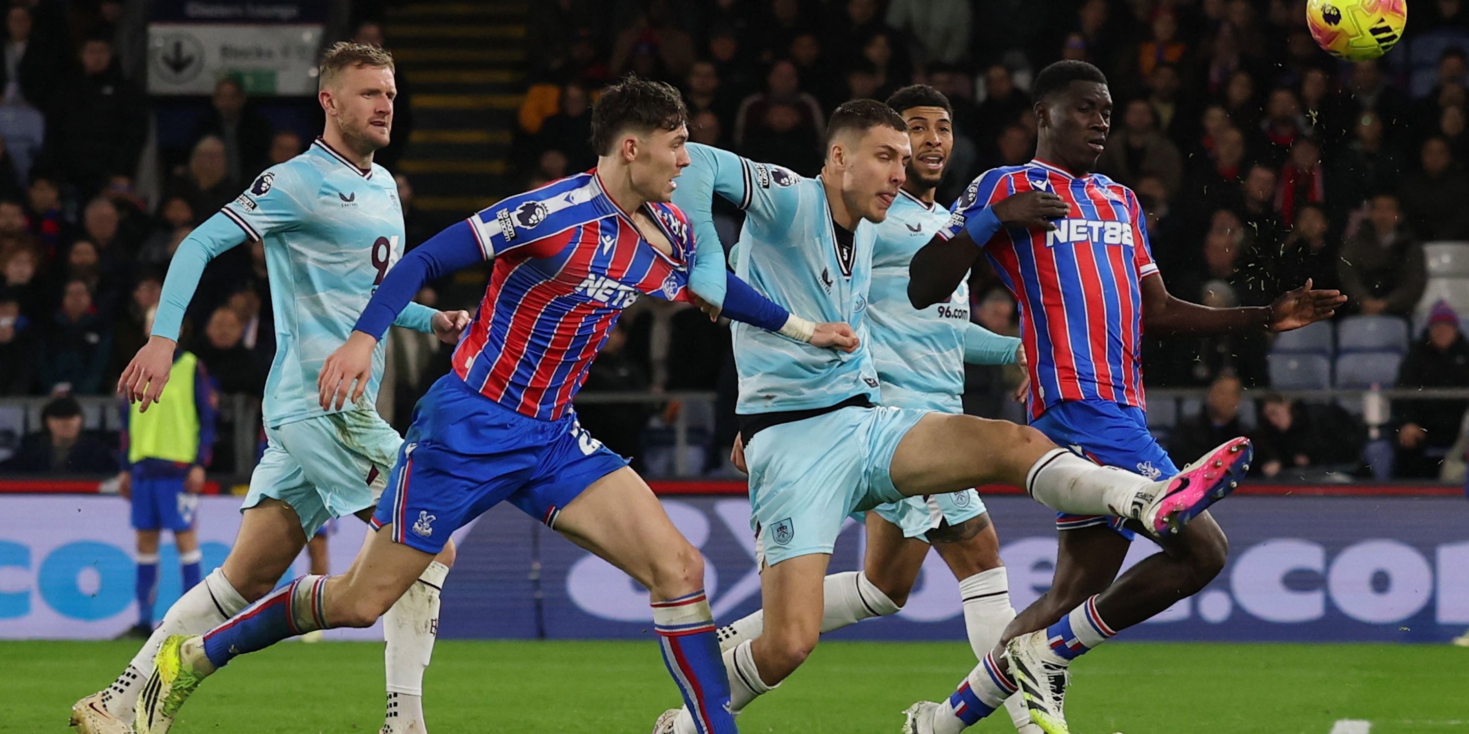 Crystal Palace's Jorgen Strand Larsen and Ismaila Sarr in action with Burnley's Maxime Esteve