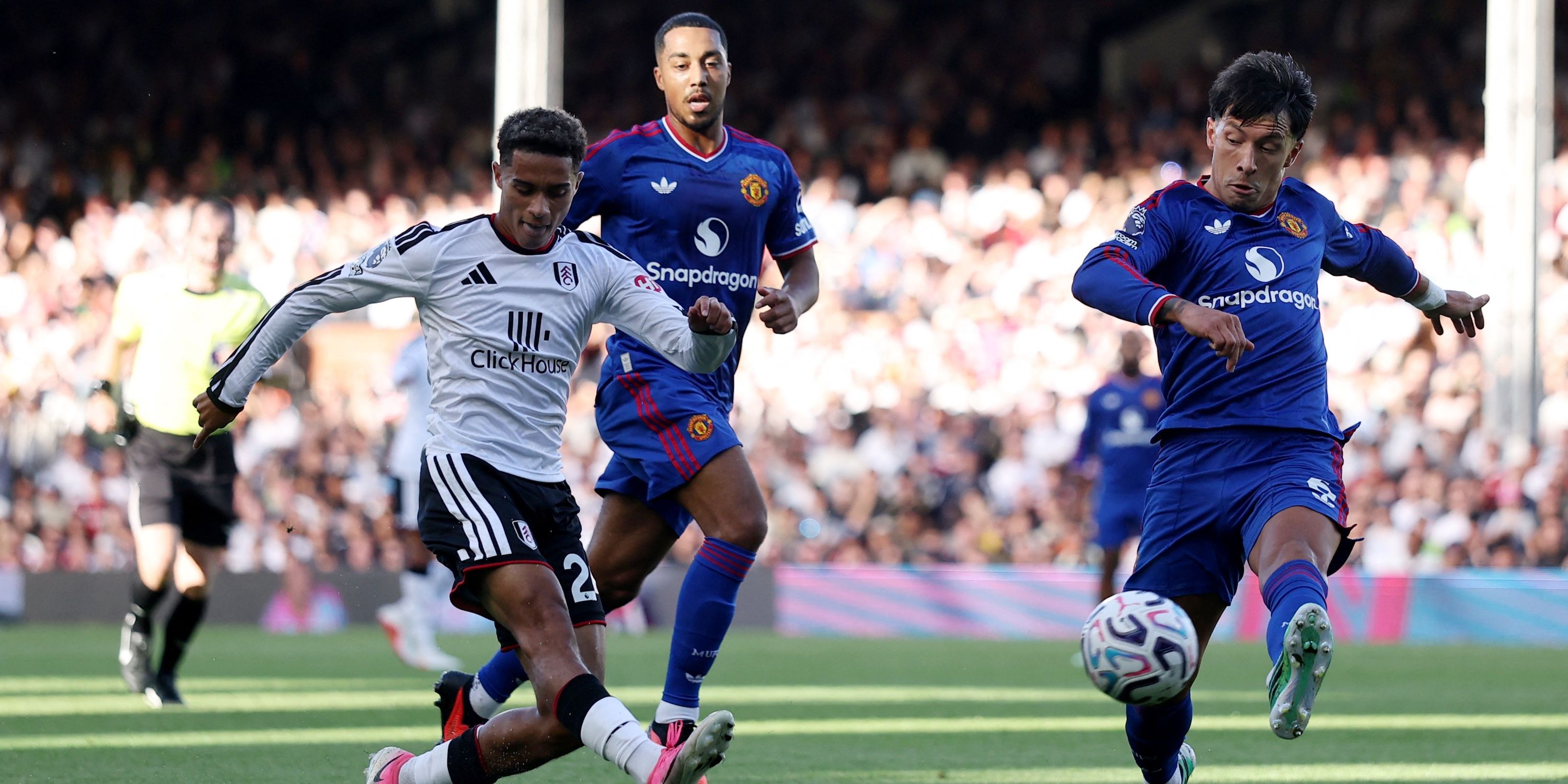 Fulham's Josh King in action with Manchester United's Lisandro Martinez