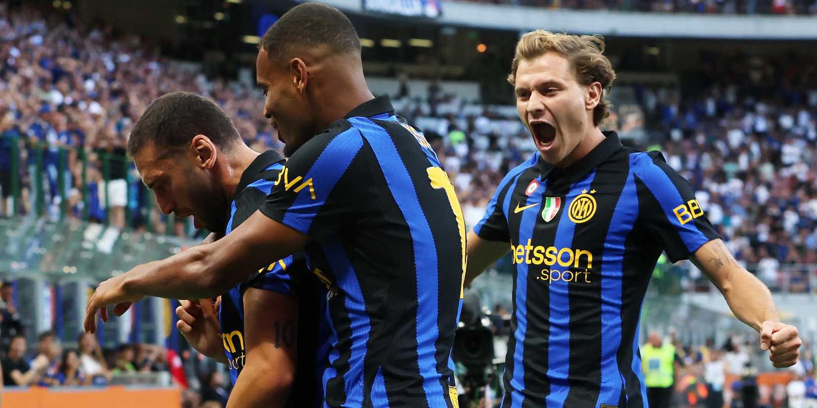 Inter Milan's Hakan Calhanoglu celebrates scoring their first goal with Nicolo Barella and Andy Diouf
