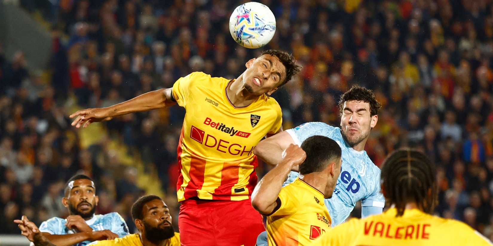 Lecce's Tiago Gabriel in action with Juventus' Dusan Vlahovic