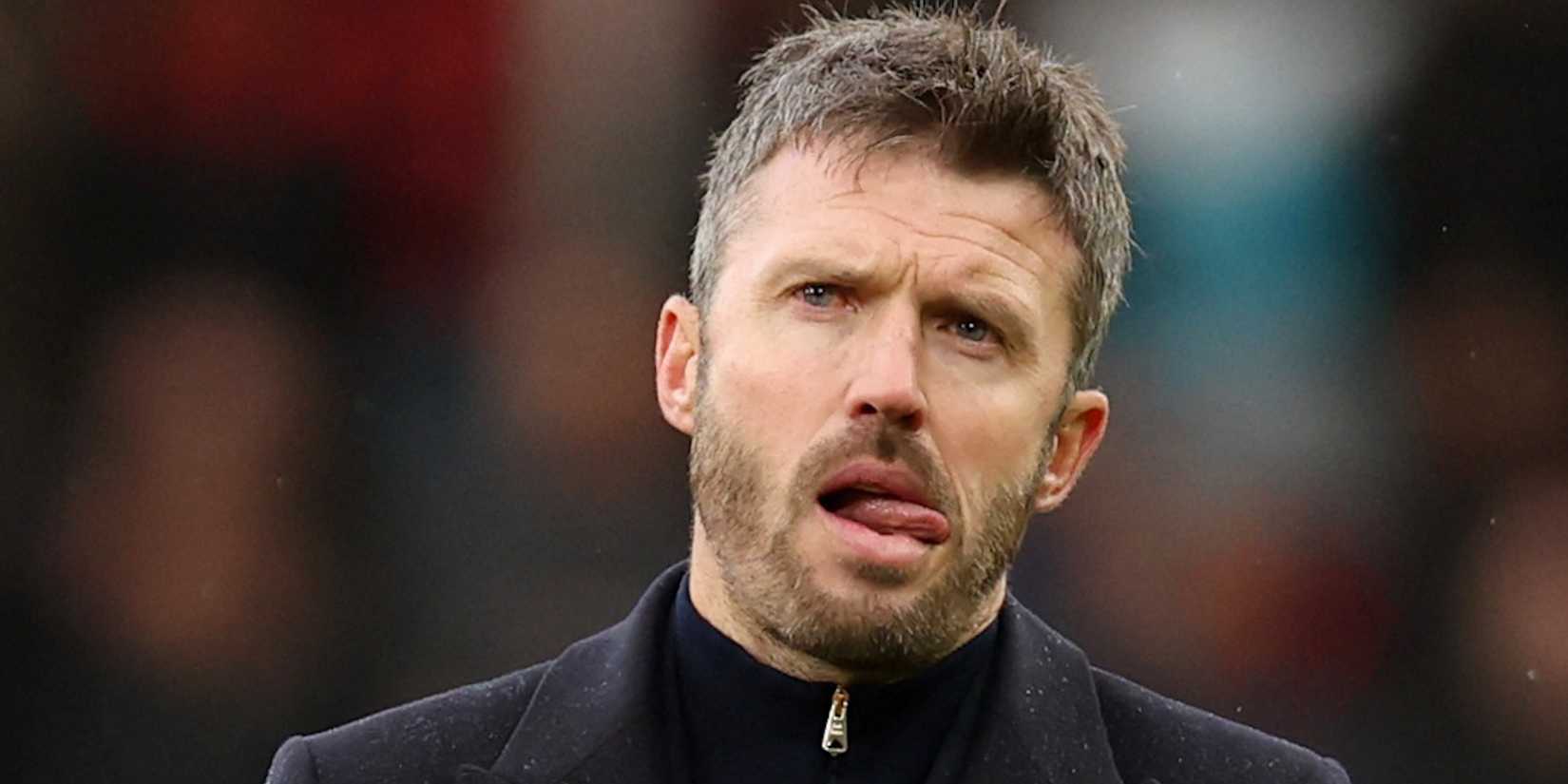 Manchester United manager Michael Carrick looks dejected as he applauds fans after the match