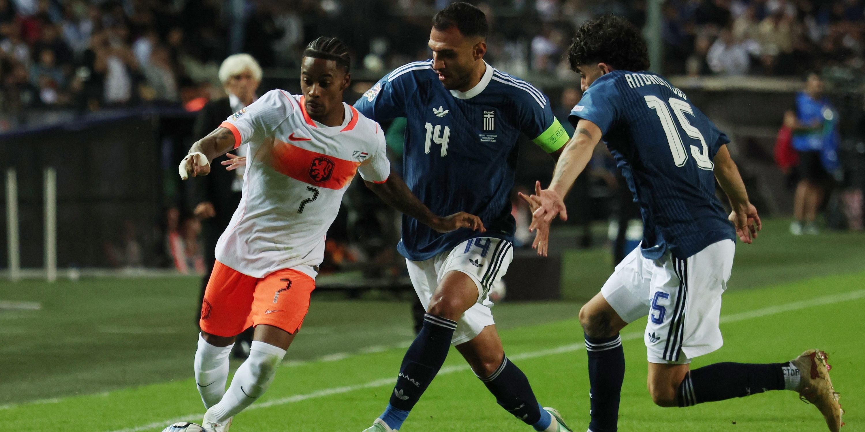 Netherlands' Crysencio Summerville in action with Greece's Vangelis Pavlidis and Thanasis Androutsos