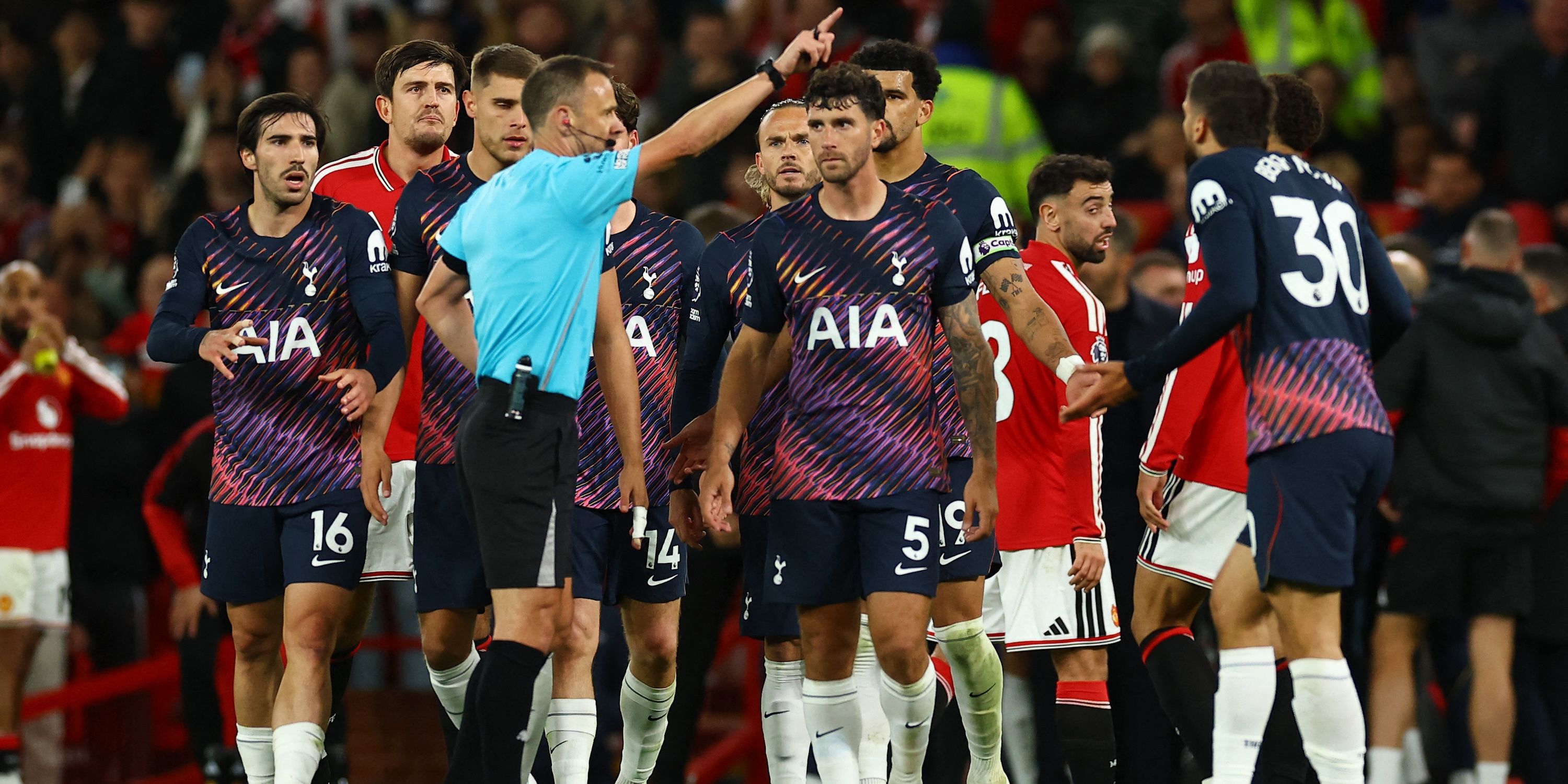 Tottenham Hotspur's Rodrigo Bentancur is shown a red card by referee Stuart Attwell