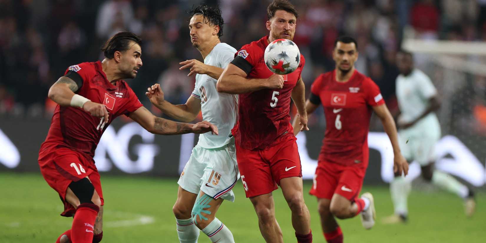 Turkey's Salih Ozcan and Abdulkerim Bardakci in action with France's Esteban Lepaul 
